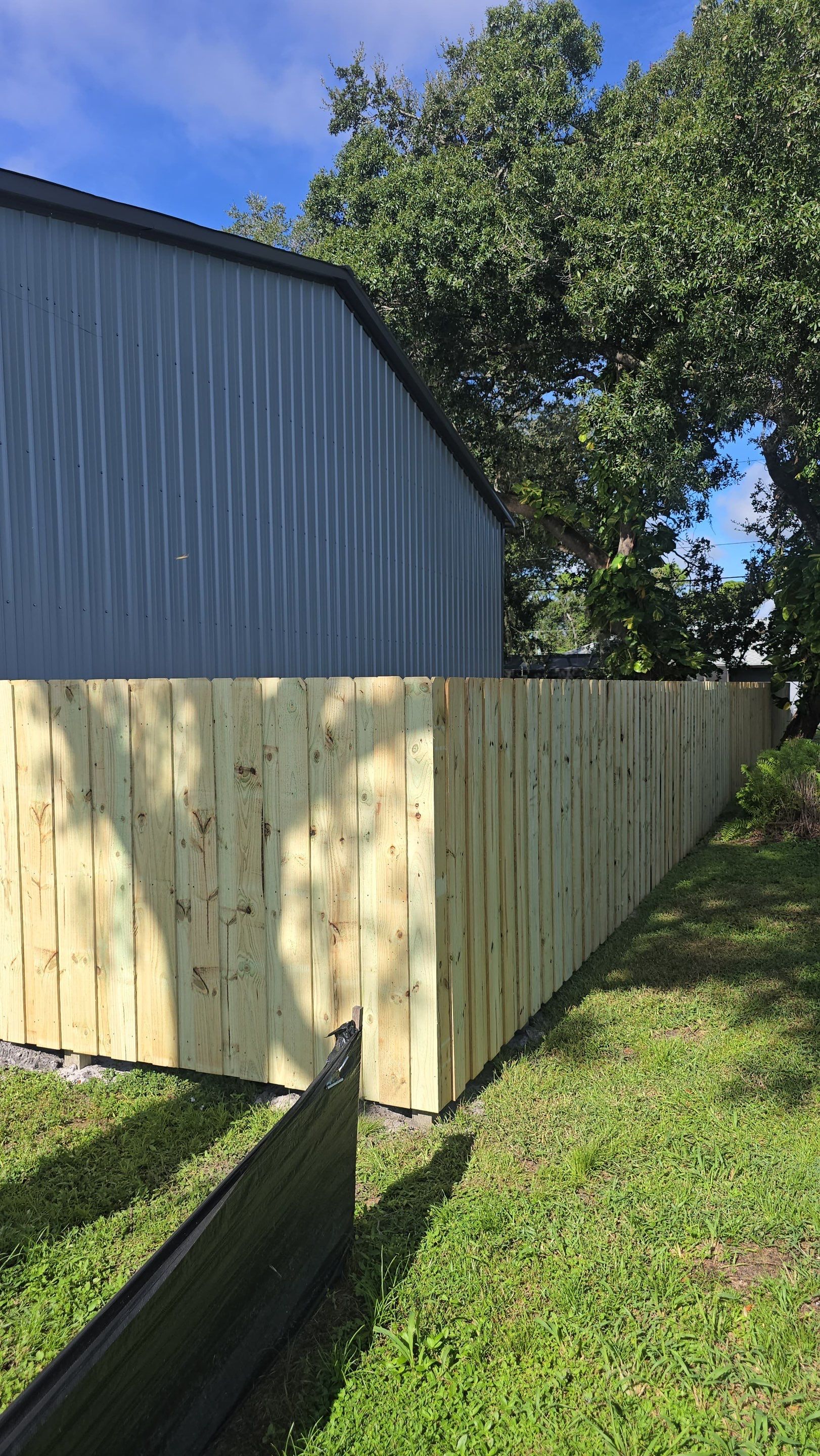Pressure-Treated Wood Privacy Fence and Gate Installation in North Port by True Fence LLC