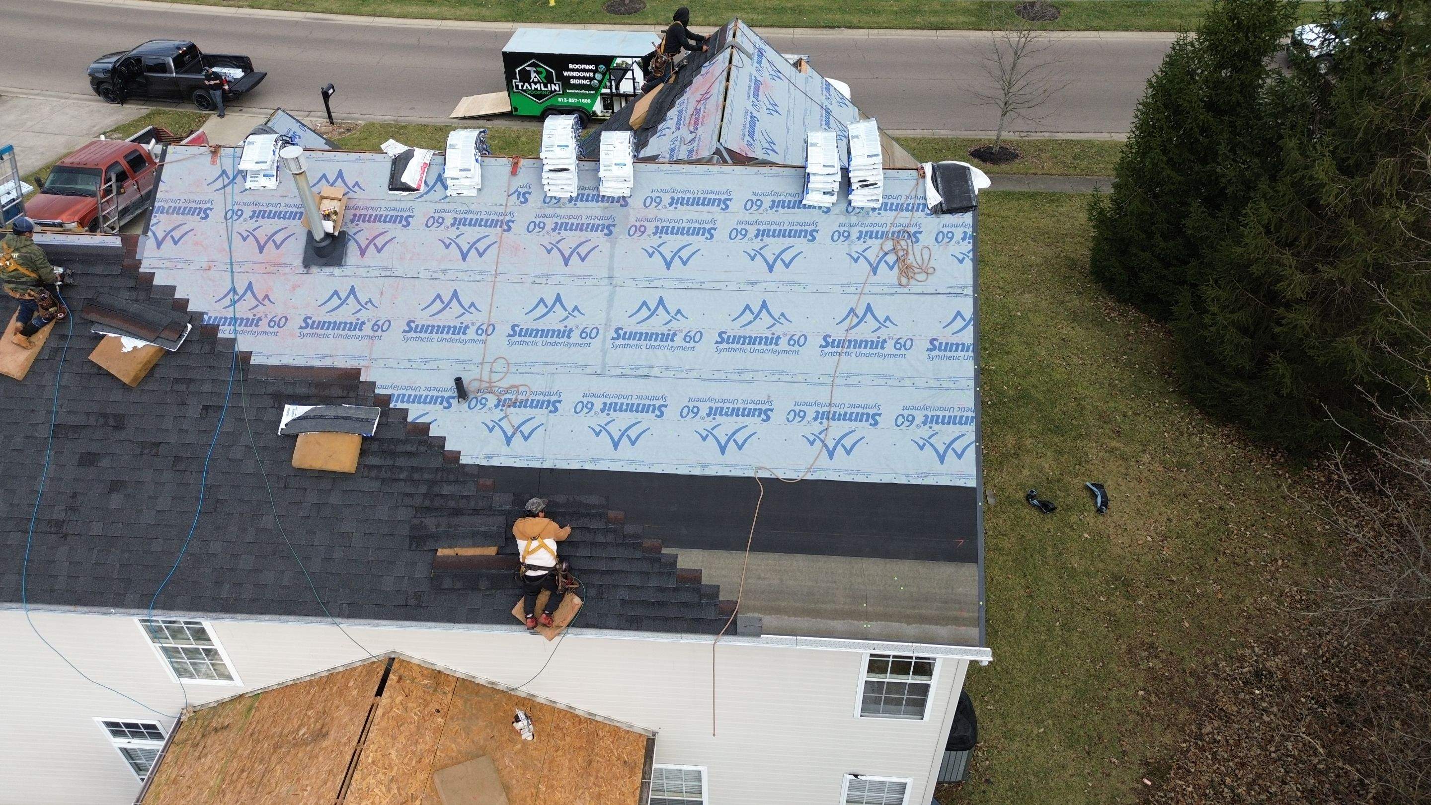 Walden Ponds - Pristine Black and Hydro Flo Gutter Guards by Tamlin Roofing