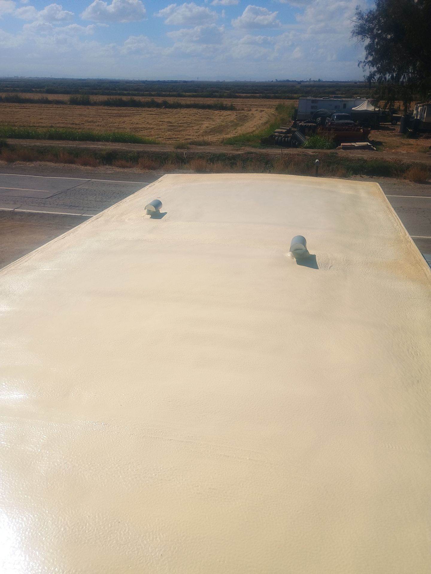 Foam and coatings on mobile home by Straight Edge Roofing Inc