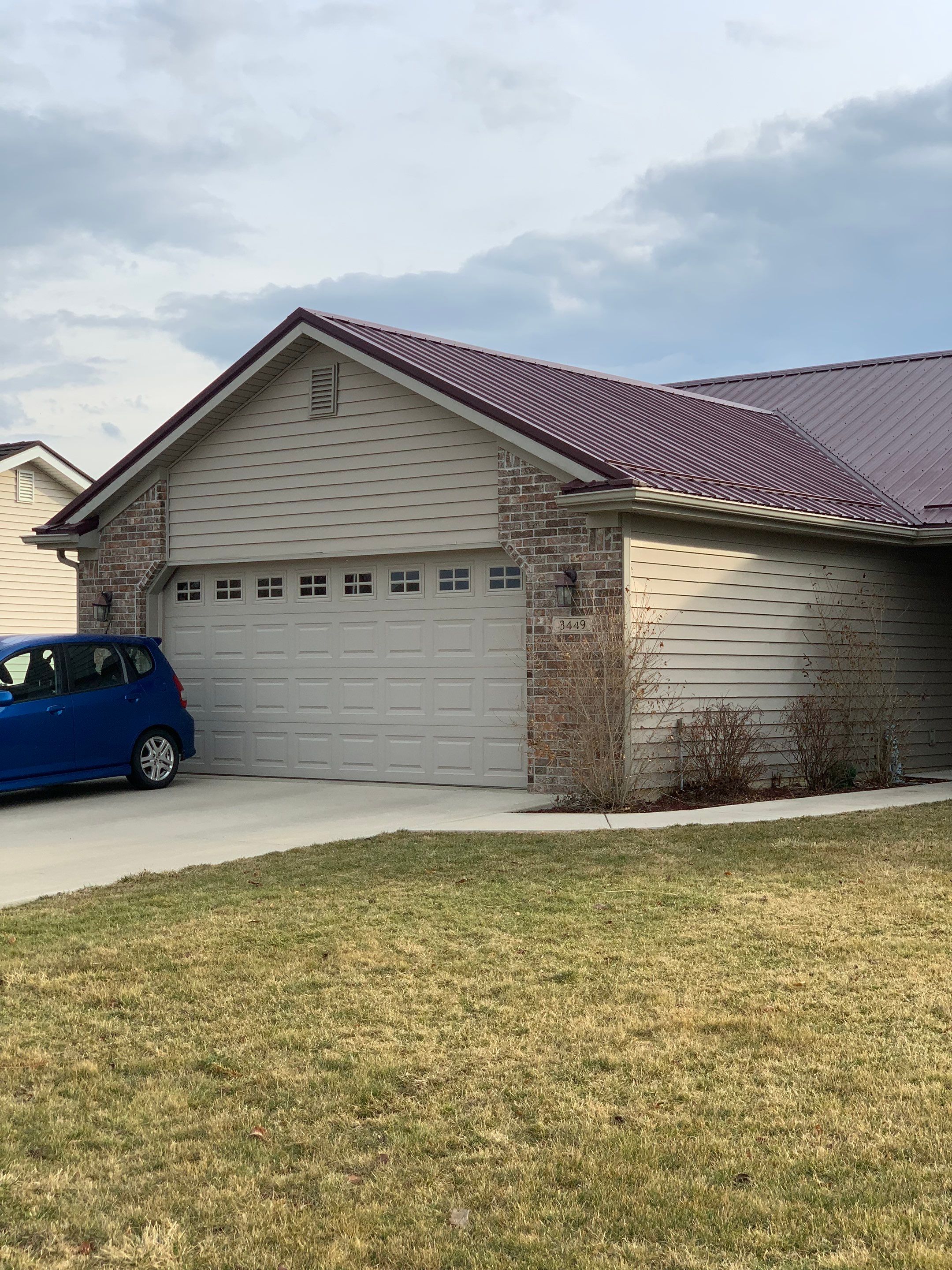 Burgundy Exposed Fastener Metal Roof in Columbia City, Indiana Country Home by 4Ever Metal Roofing