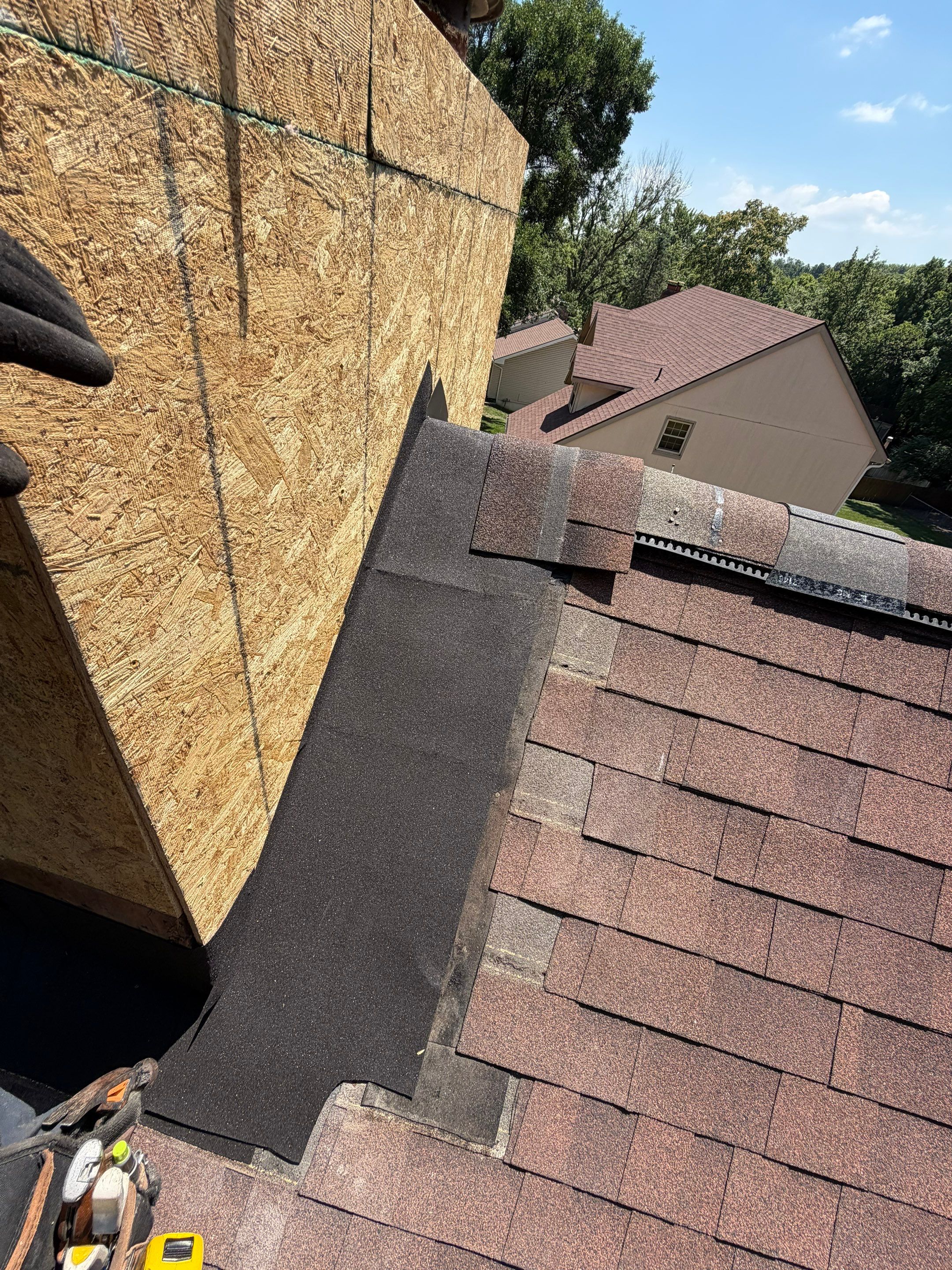 Structural Stone Chimney Restoration and Roof Repair in Leavenworth by Summit Roofing