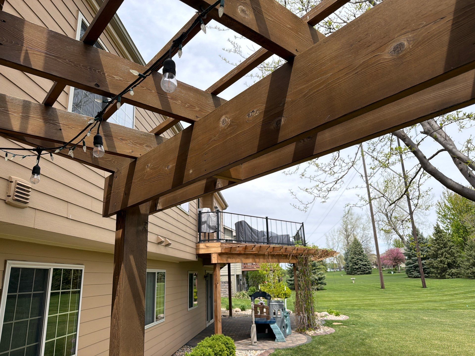 Tiered Wood Deck and Pergola Refinishing in Sioux Falls by Select Painting, Coatings & Garage Cabinets