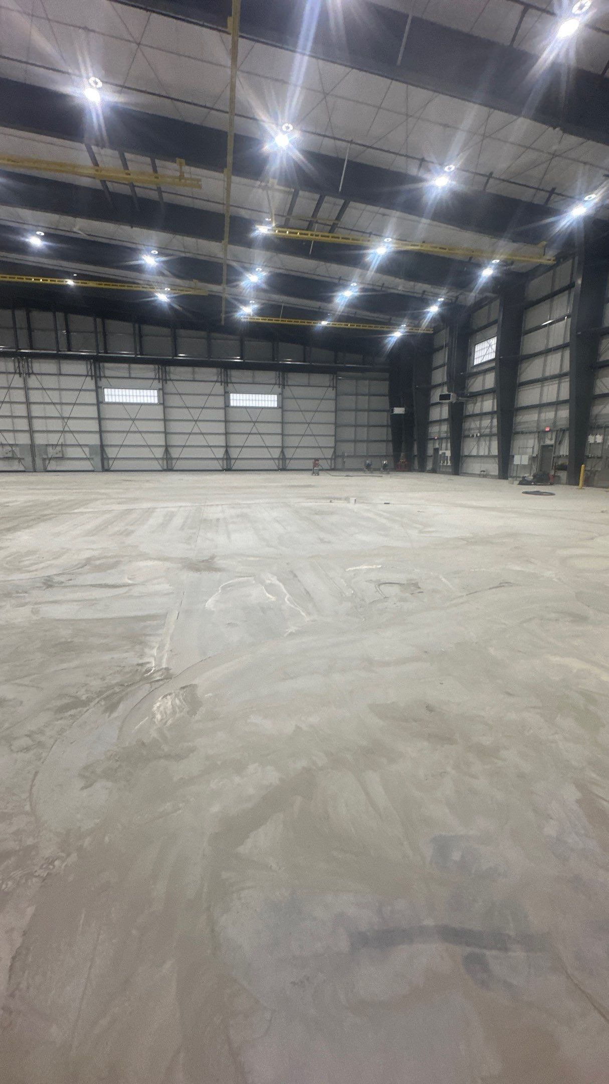 Airplane Hanger using Light Grey Commercial Penntek Epoxy by Croc Coatings, LLC