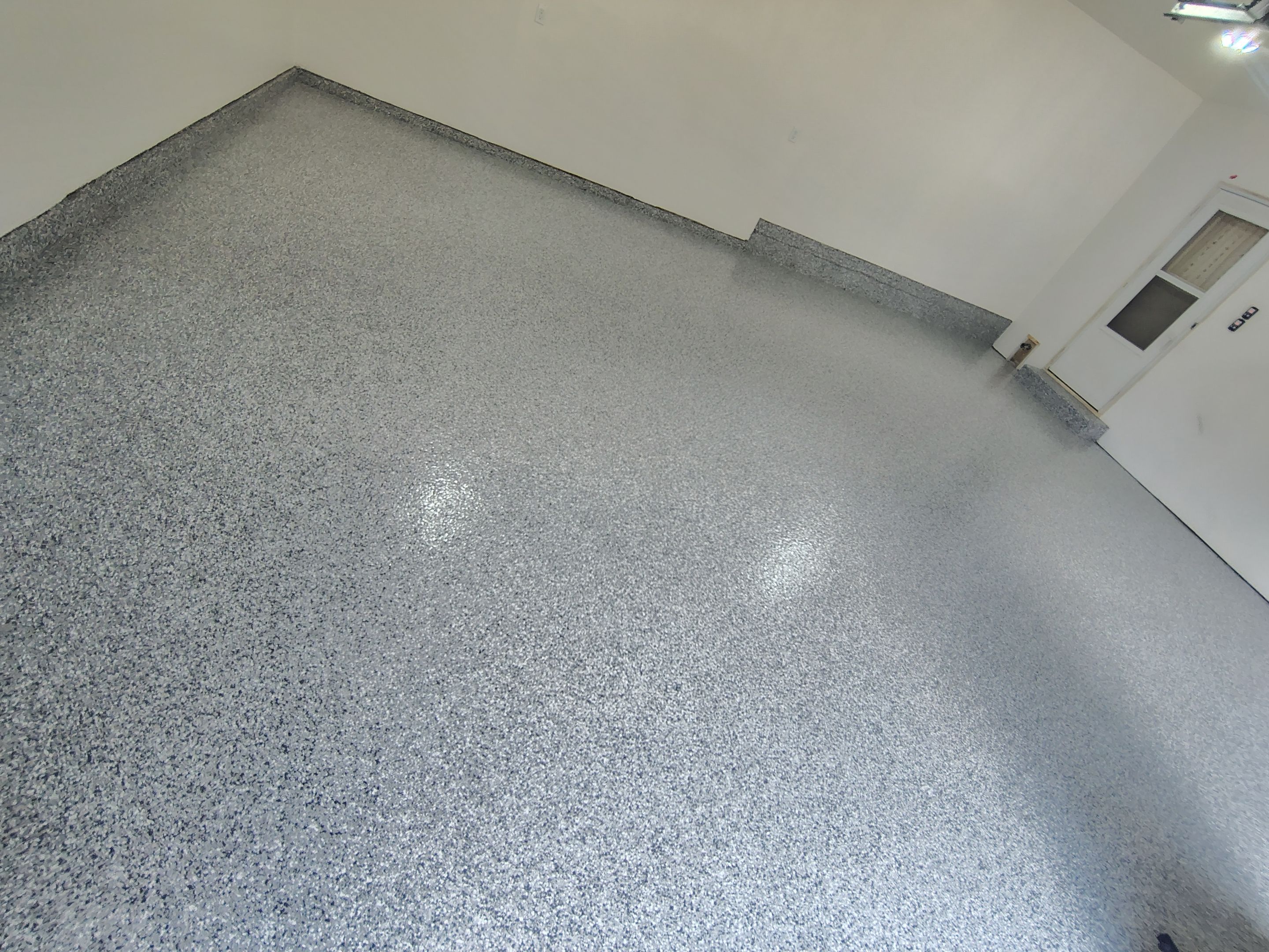 Epoxy Concrete Coating and Garage Floor Restoration in Sioux Falls by Select Painting, Coatings & Garage Cabinets