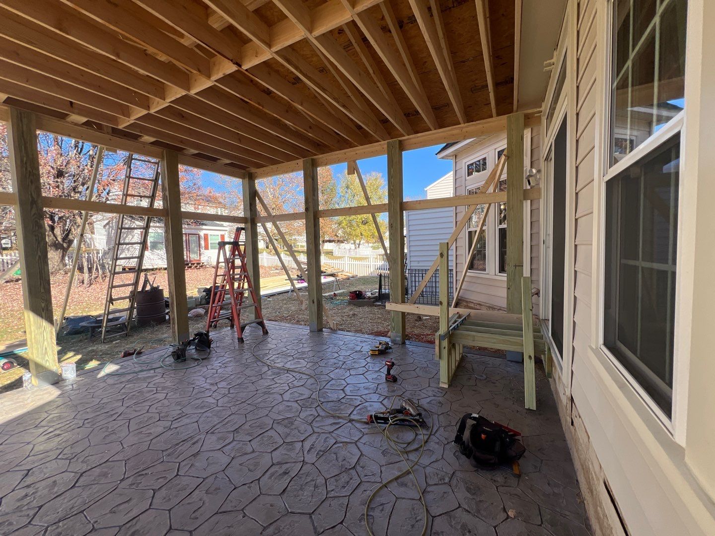 Custom Screened-In Porch with Stamped Concrete Patio in Warrenton by Jakari Restoration & Construction LLC