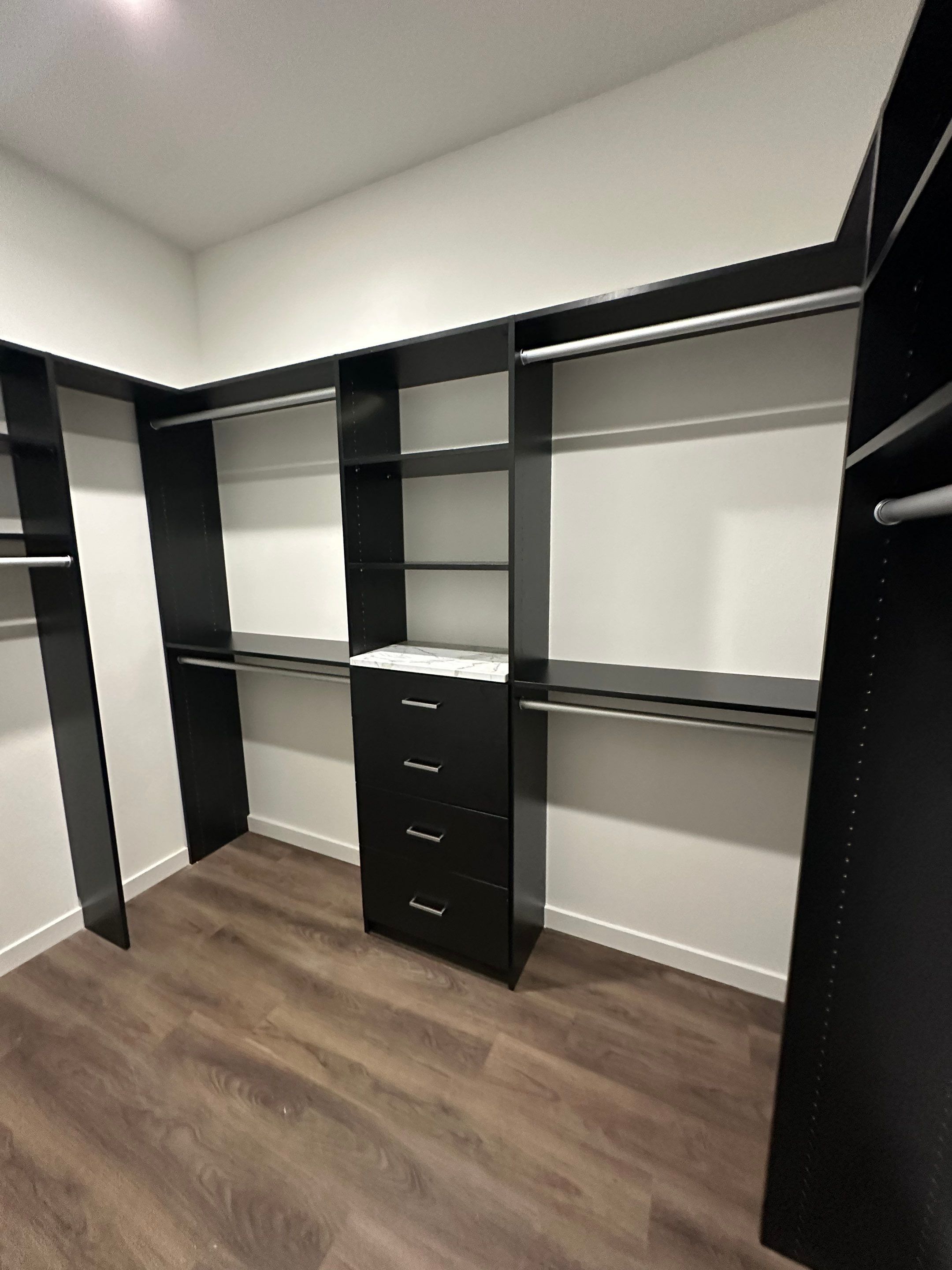 Custom Black Laminate Walk-In Closet Installation in Tampa by Square 1 Garage and Closet Solutions