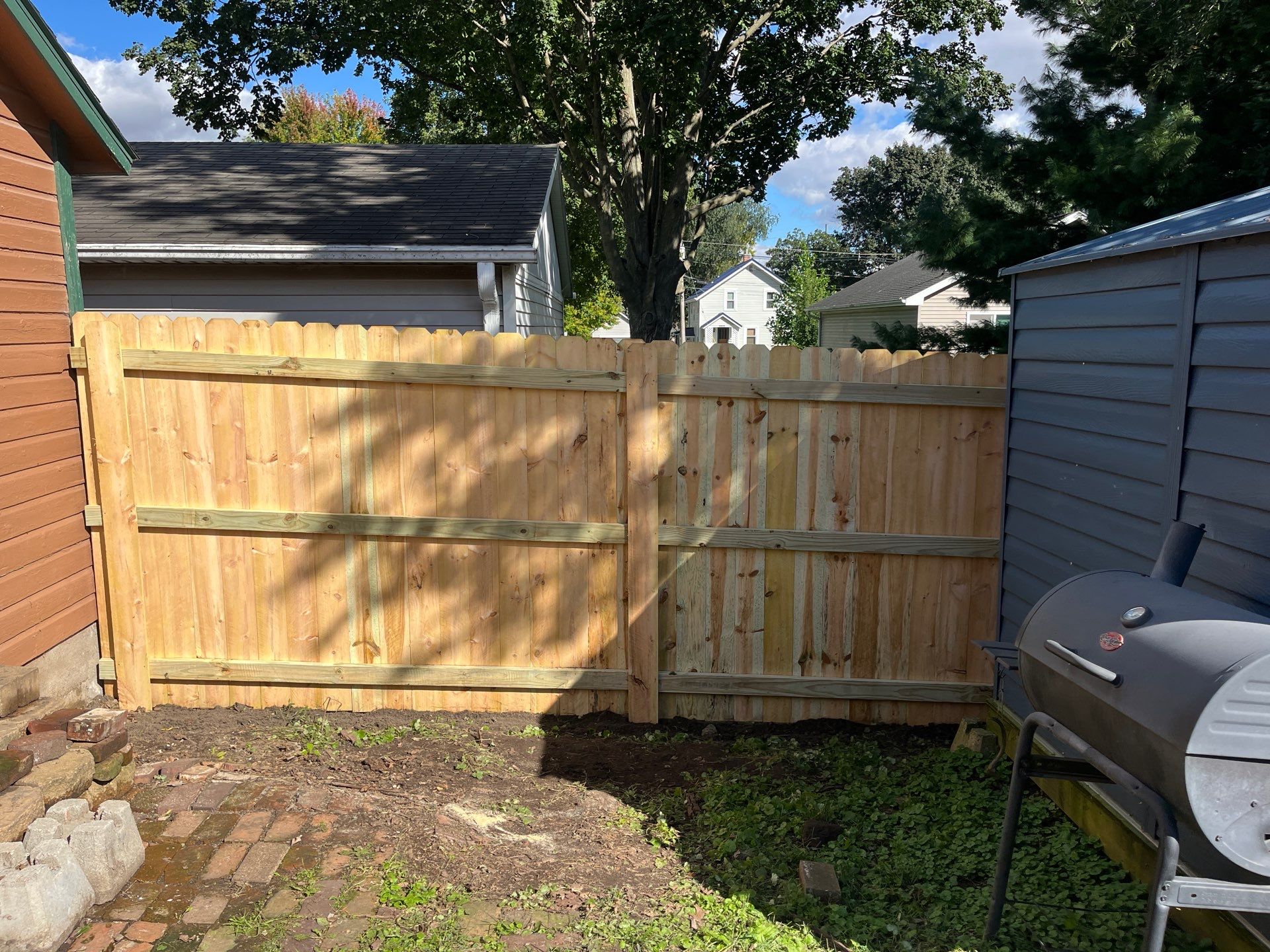 Pressure-Treated Wood Privacy Fence Installation in Waverly, Iowa by Perfect Picket Fence and Stain