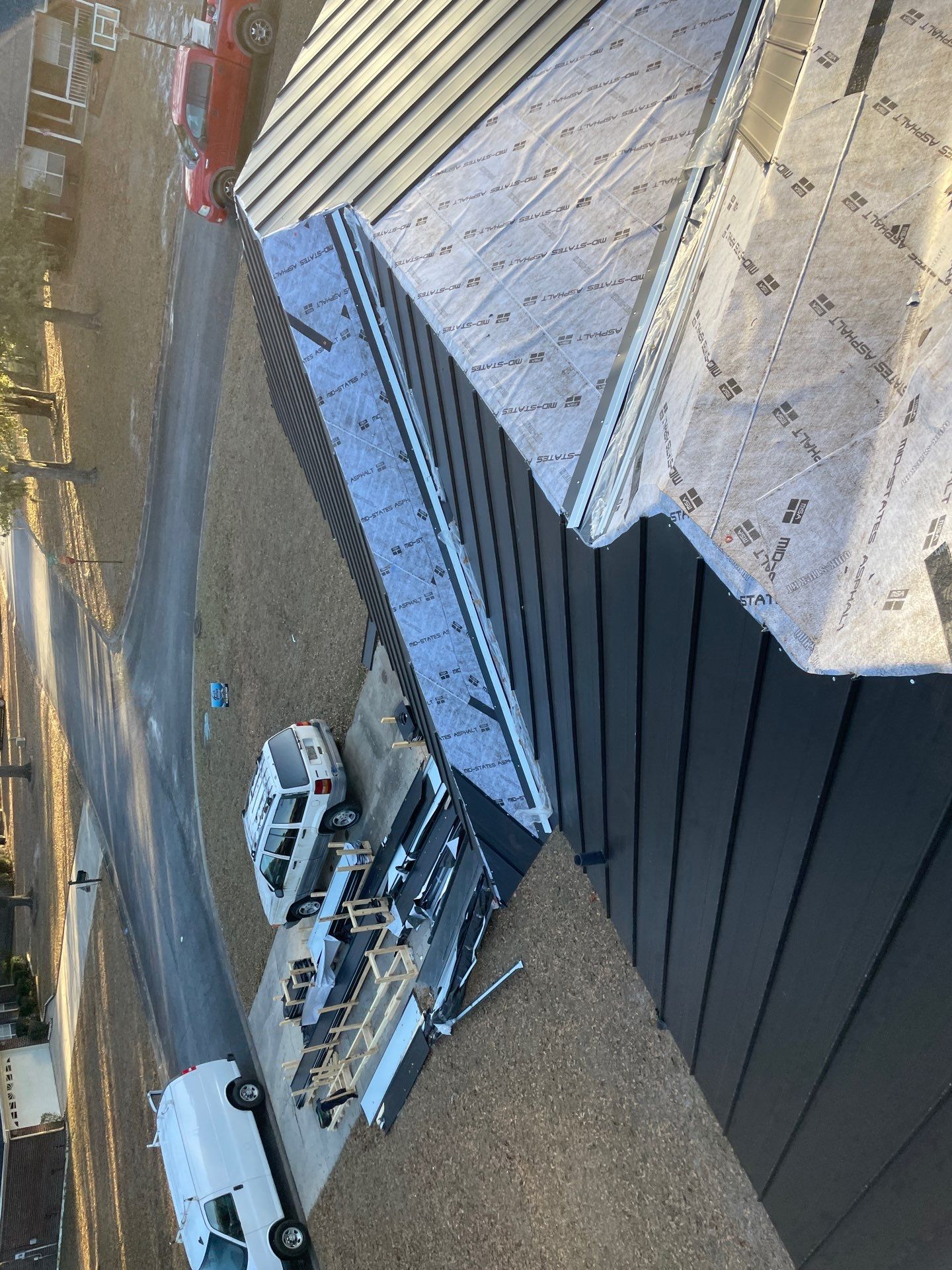 Residential Roofing Installation using Benton 26Ga 1inc Snapcock Metal Roof KYNAR Matte Black by Talya Roofing