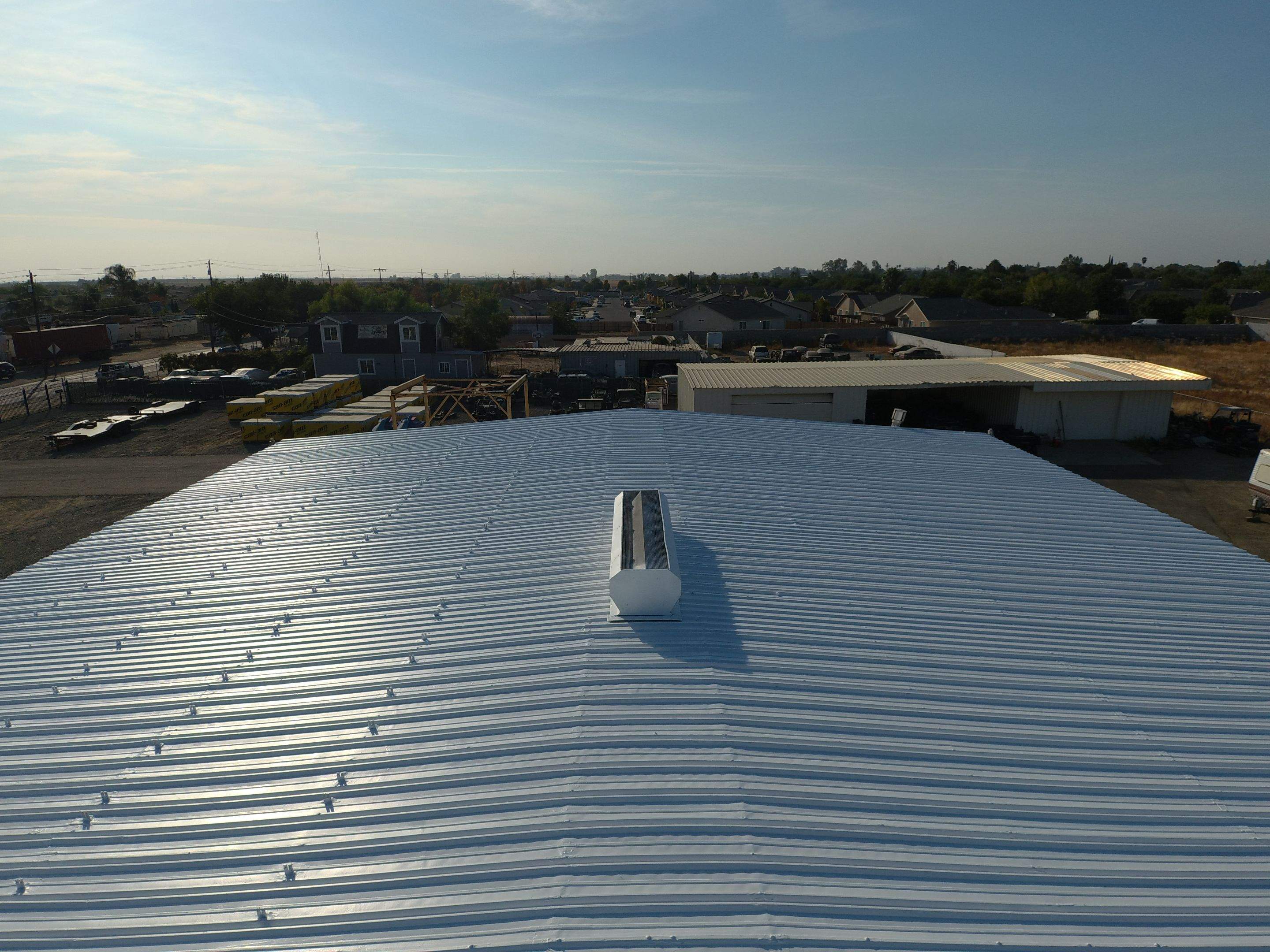 Metal Restoration Roofing system with Benchmark/PUMA XL 20 yr warranty by Straight Edge Roofing Inc