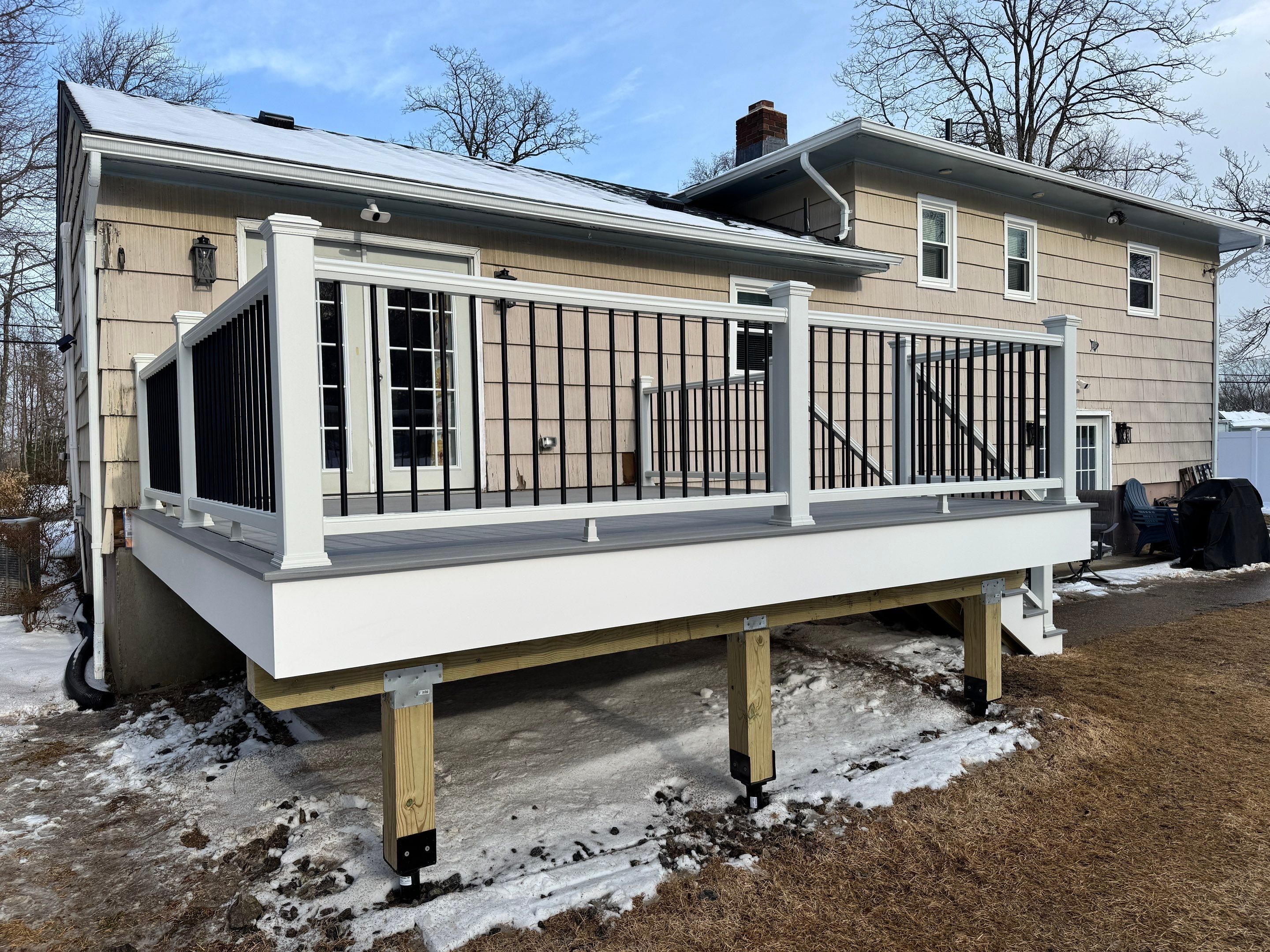 Deck replacement using Trex Lineage Rainier , and Transcend White railing.  by DiGiorgi Roofing and Siding Inc