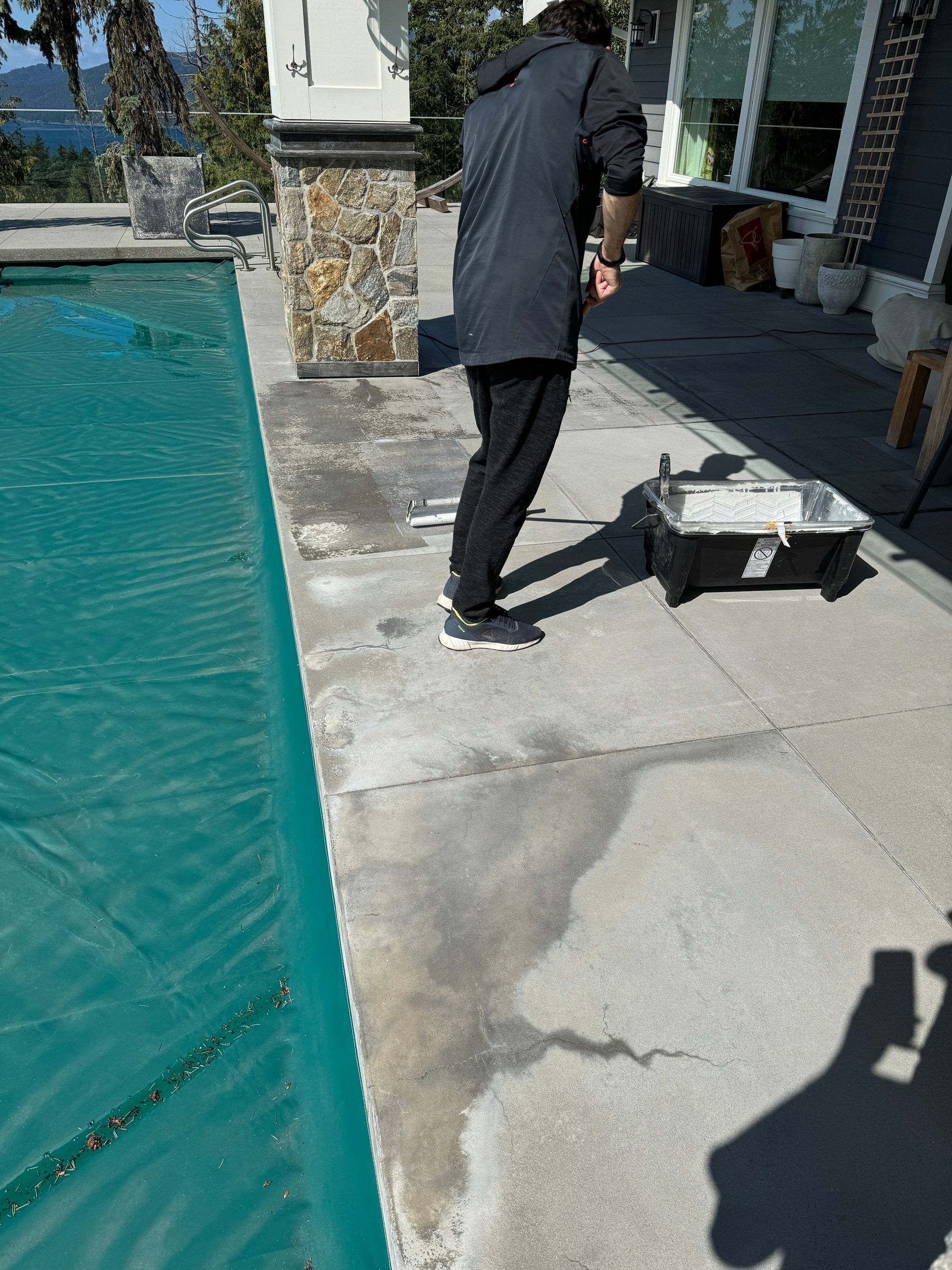Applying Concrete Sealer  by YVR Construction Group