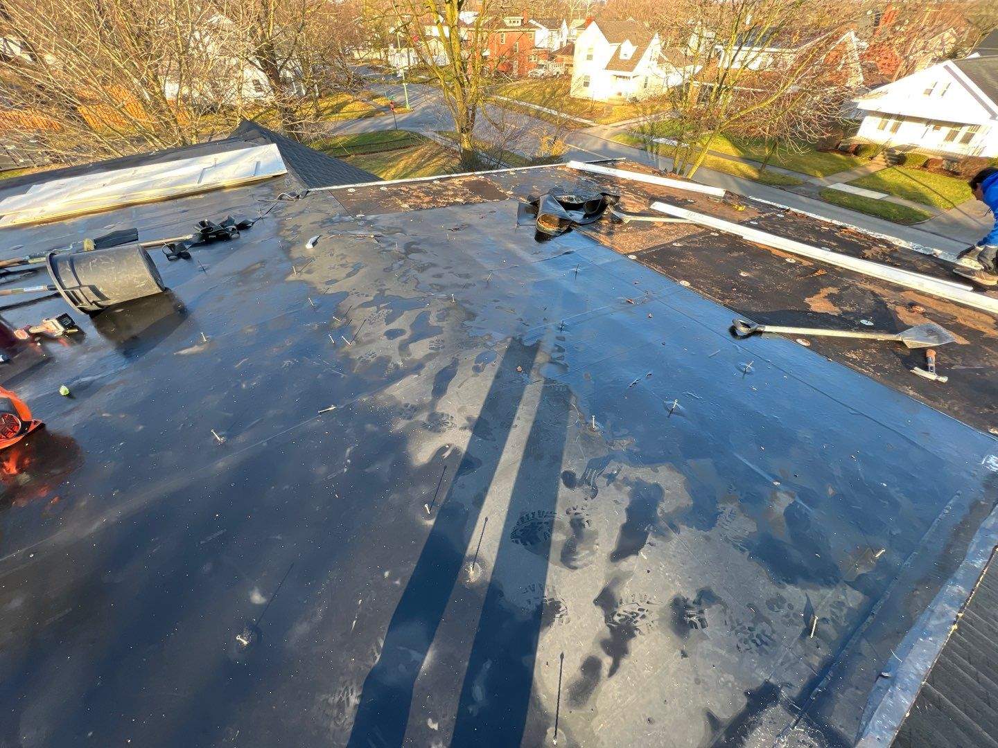 Residential Roofing Installation using 60 mil rubber roof by Nitro Roofing and Construction
