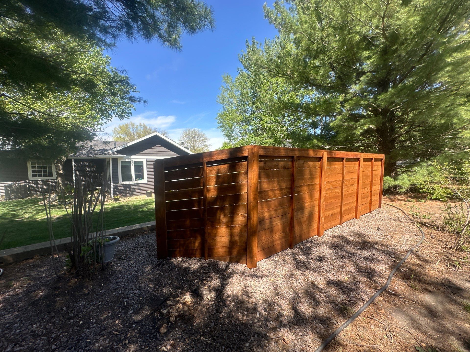Horizontal Stained Wood Privacy Fence Installation in Waterloo by Perfect Picket Fence and Stain