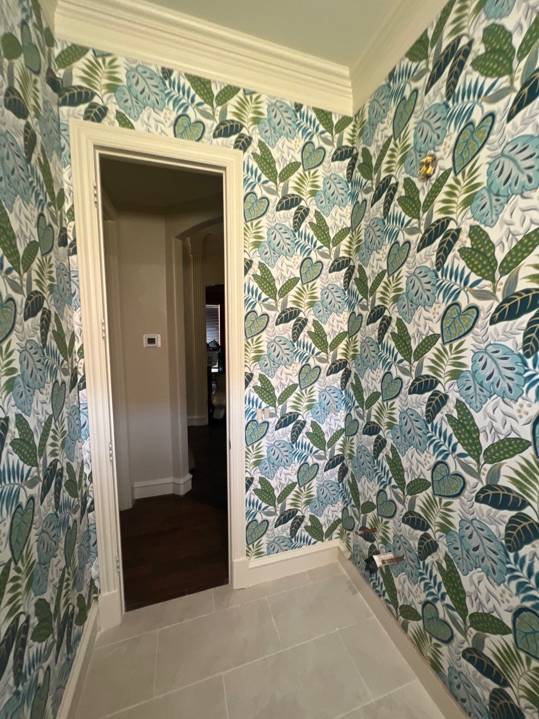 Wallpaper Installation in the Bathroom by Nomad Painting