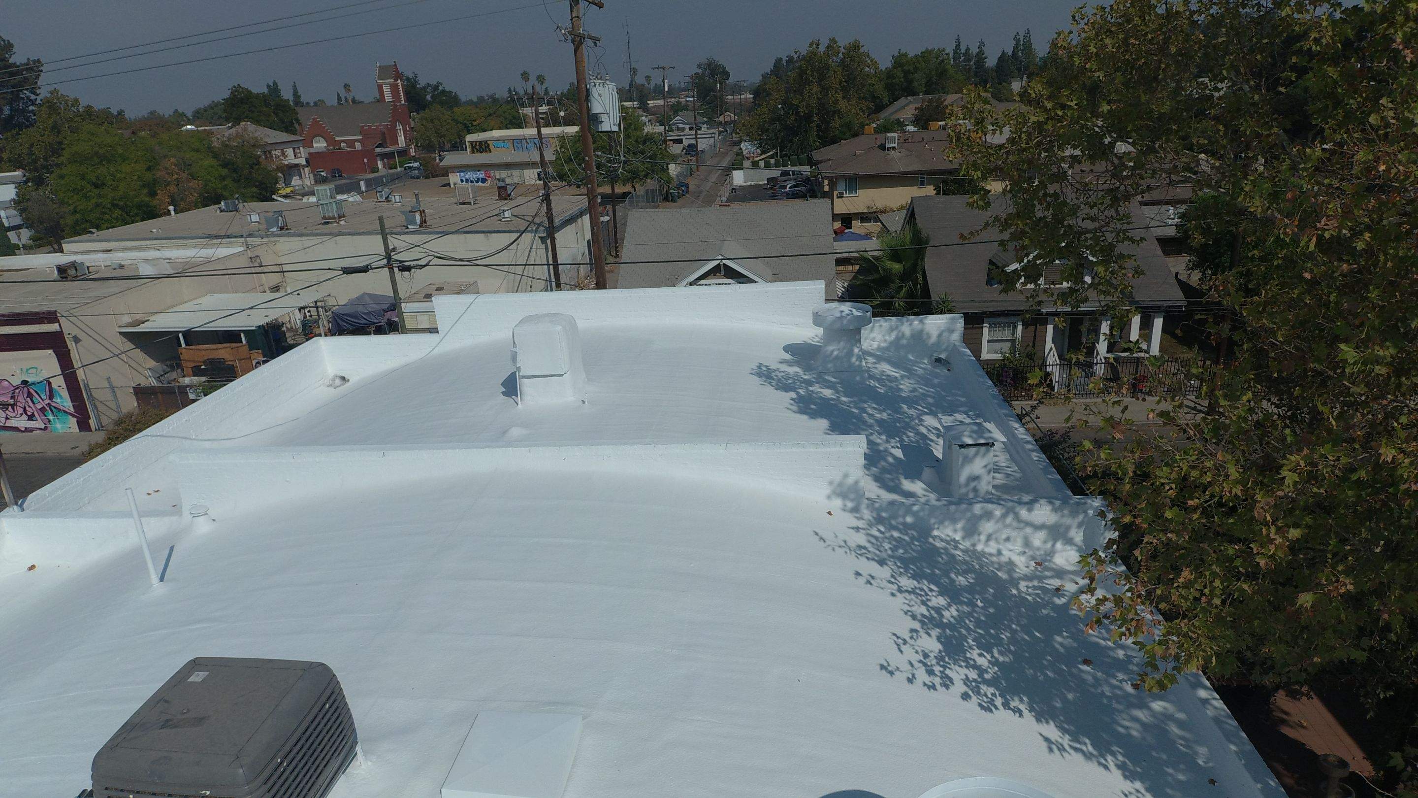 Polyurethane foam roof refurbish and recoating by Straight Edge Roofing Inc