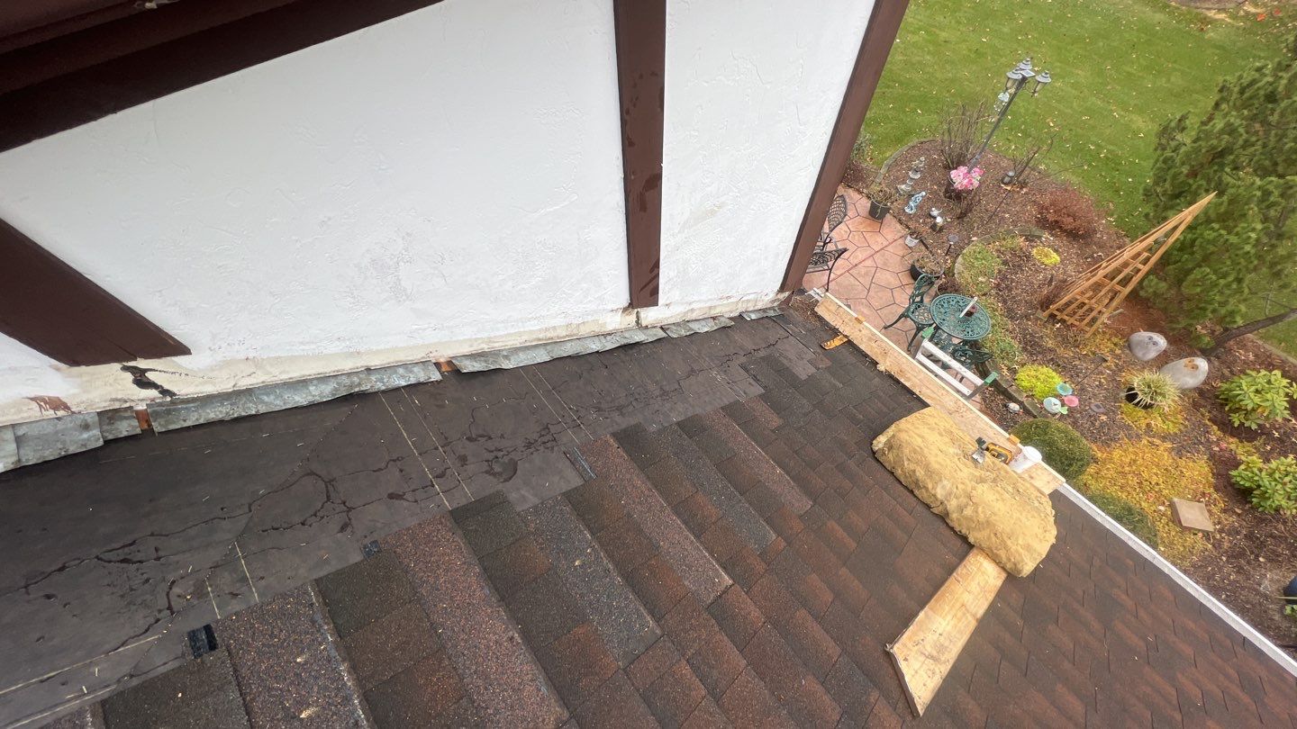Step flashing repair on roof to wall by Pro Home Services Inc
