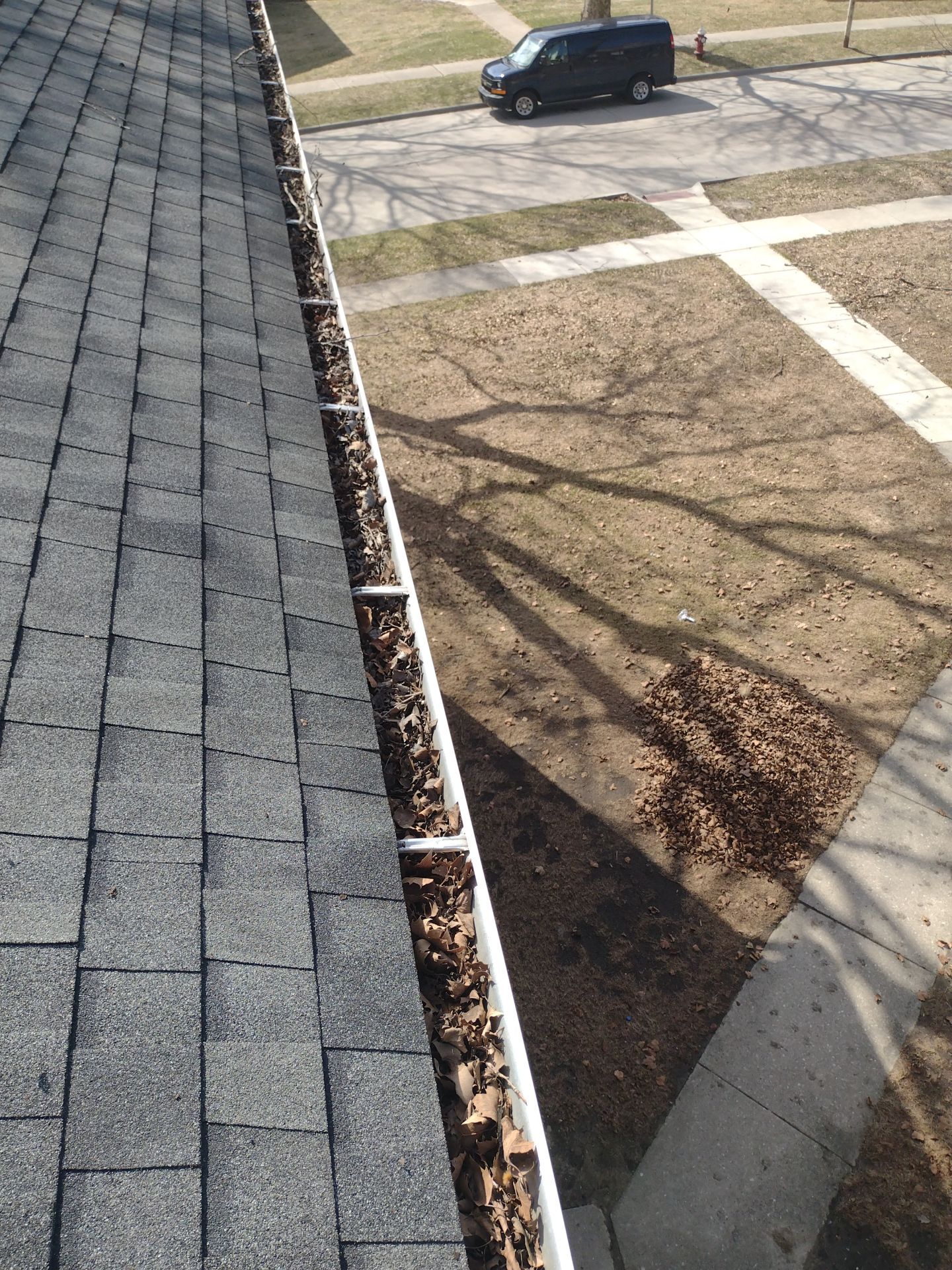 Commercial gutter cleaning Toledo, OH before photo with filled gutters