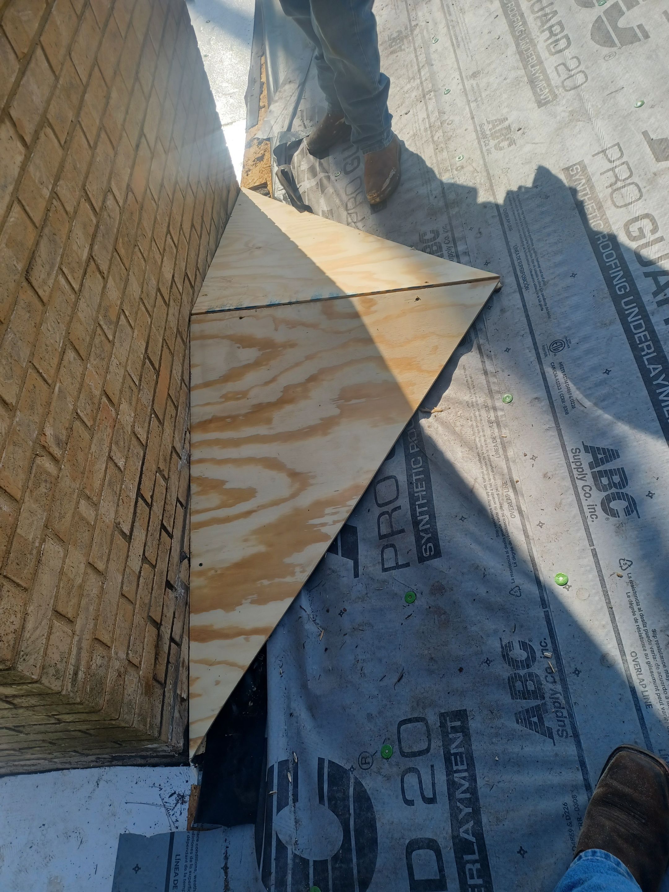 Residential Roofing Installation using PVC membrane and 24 gauge Standing Seam Metal by Hostetler Roofing