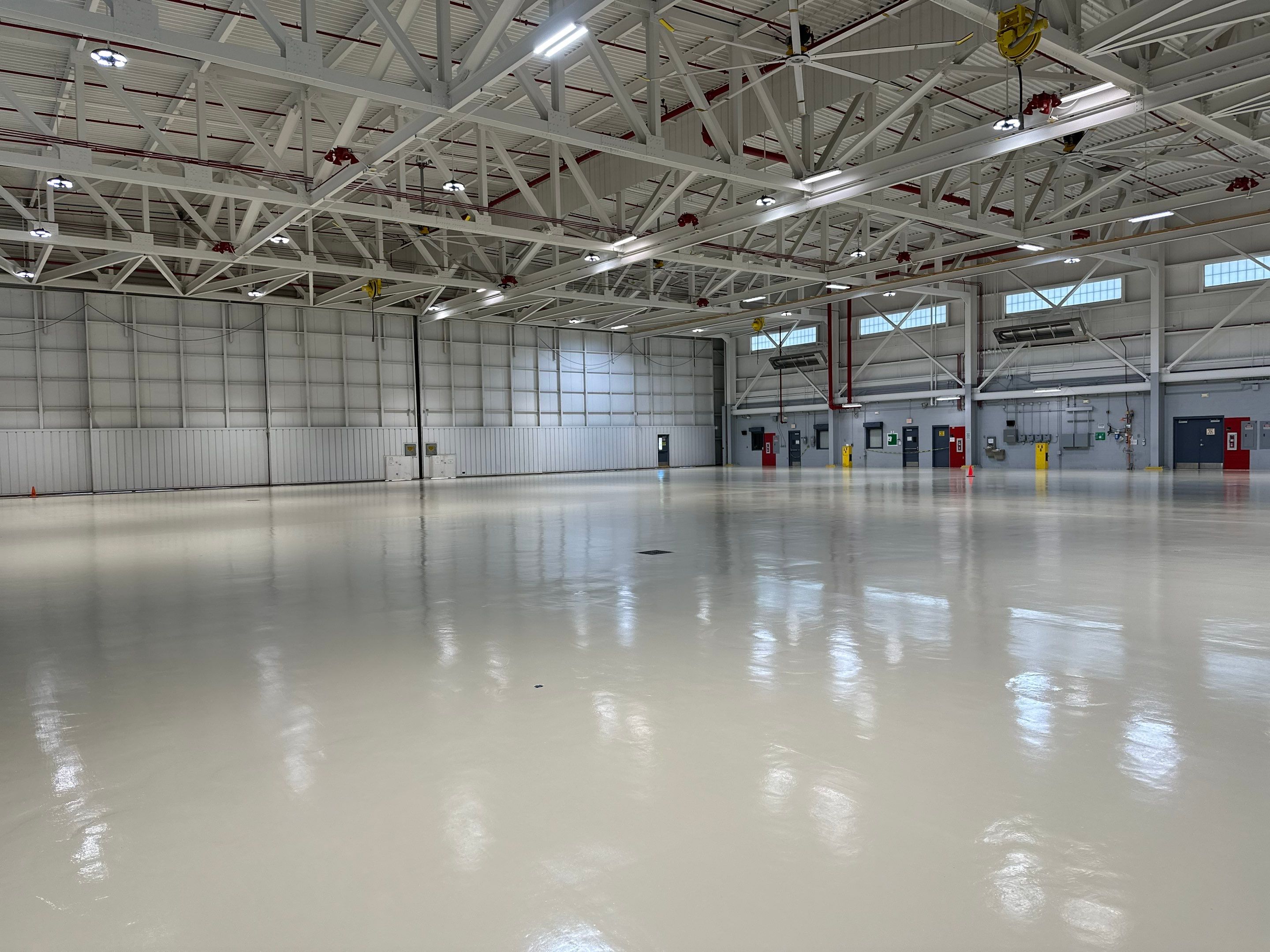 Industrial Epoxy Flooring for Army National Guard Hangar in Mobile by Cornerstone Hard Surface Restoration 