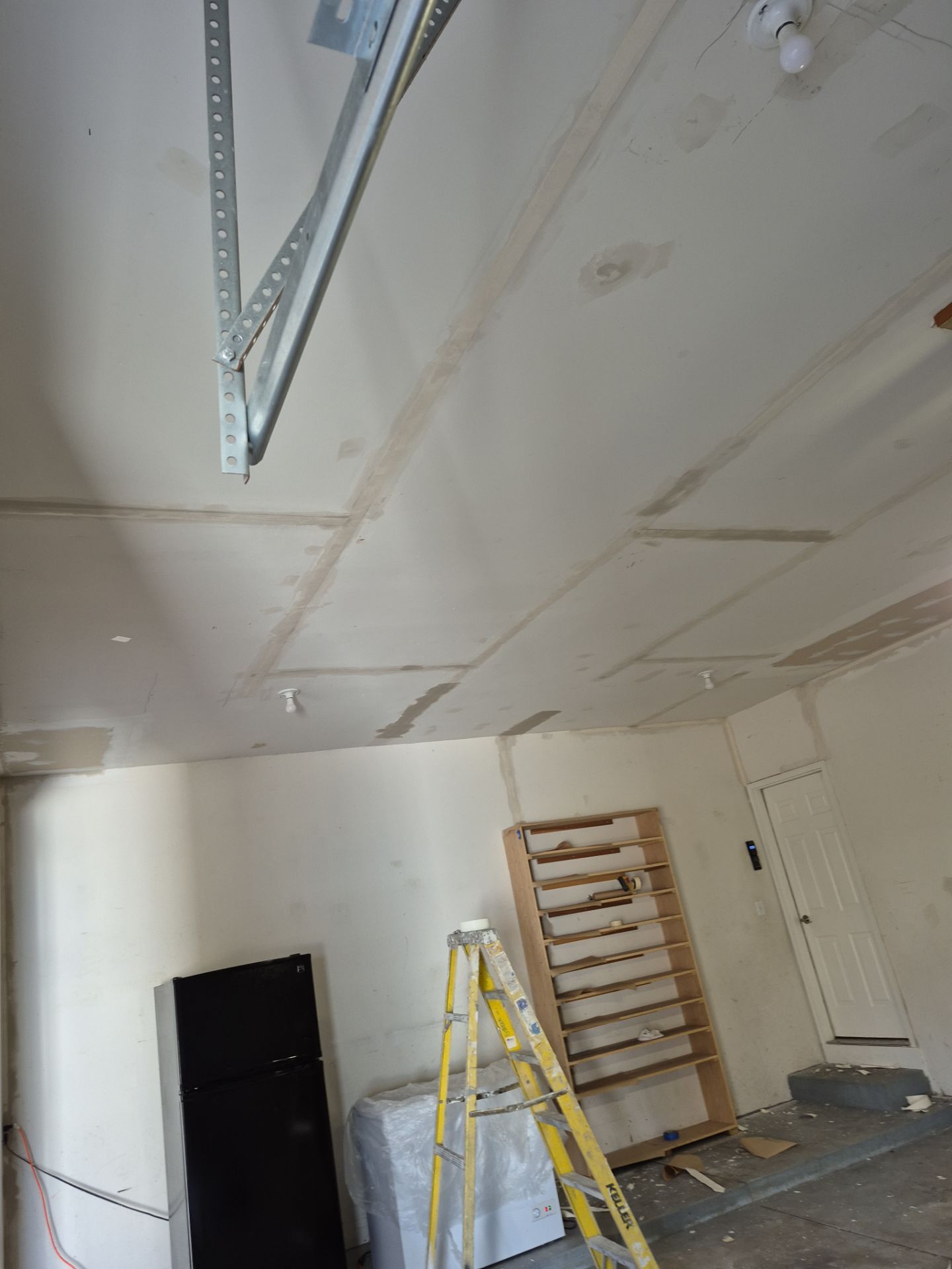 Custom Epoxy Flake Floor and Garage Wall Renovation in Ada by Gordon Painting