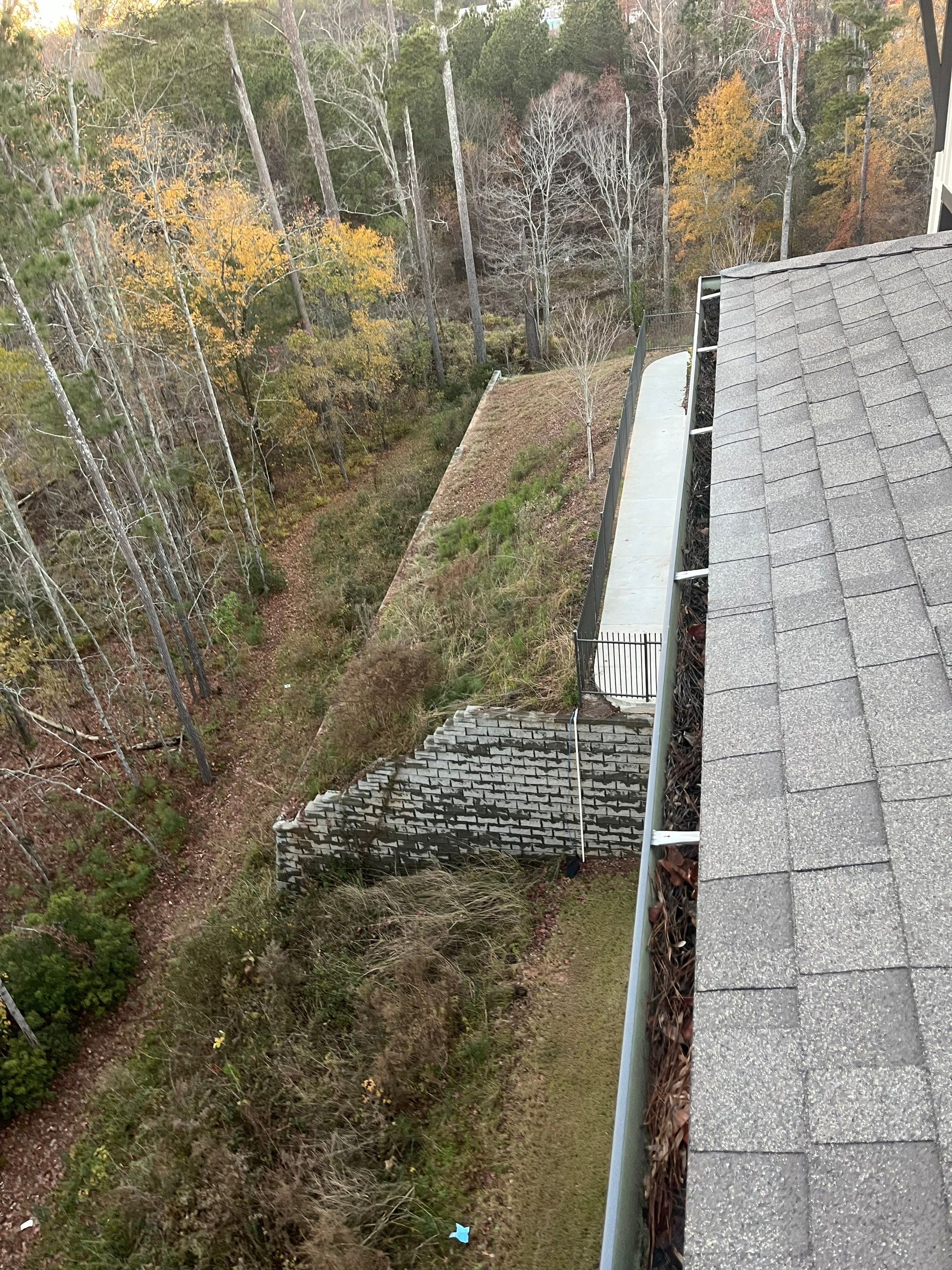 HOA gutter cleaning in Pinehurst & Southern Pines, NC,before  photo showing full gutters.