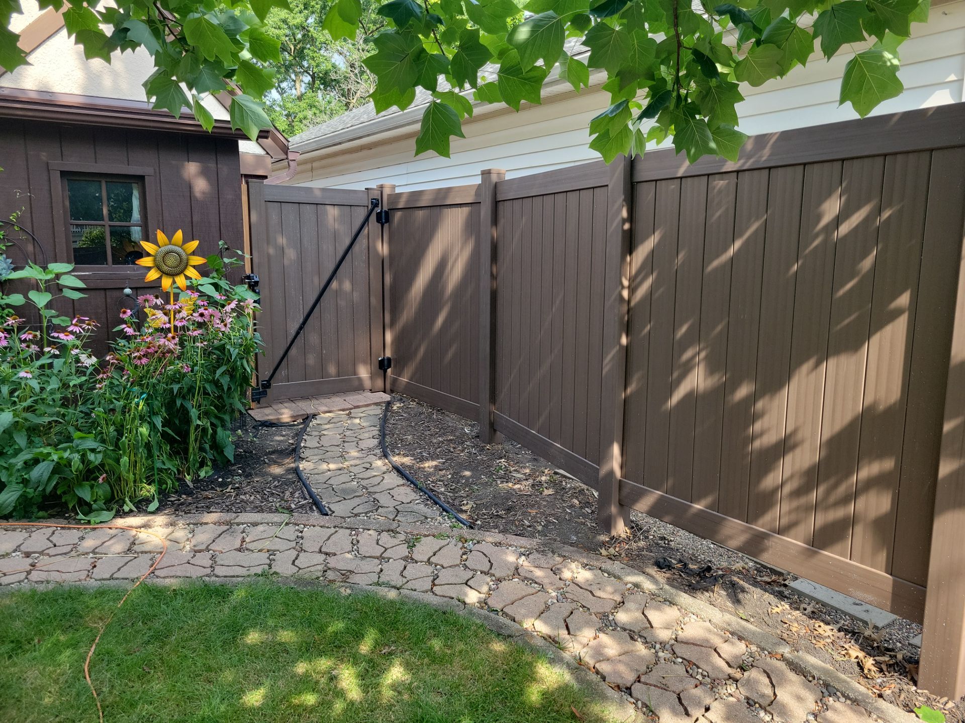 Walnut Vinyl Privacy Fence Installation in Waterloo by Perfect Picket Fence and Stain