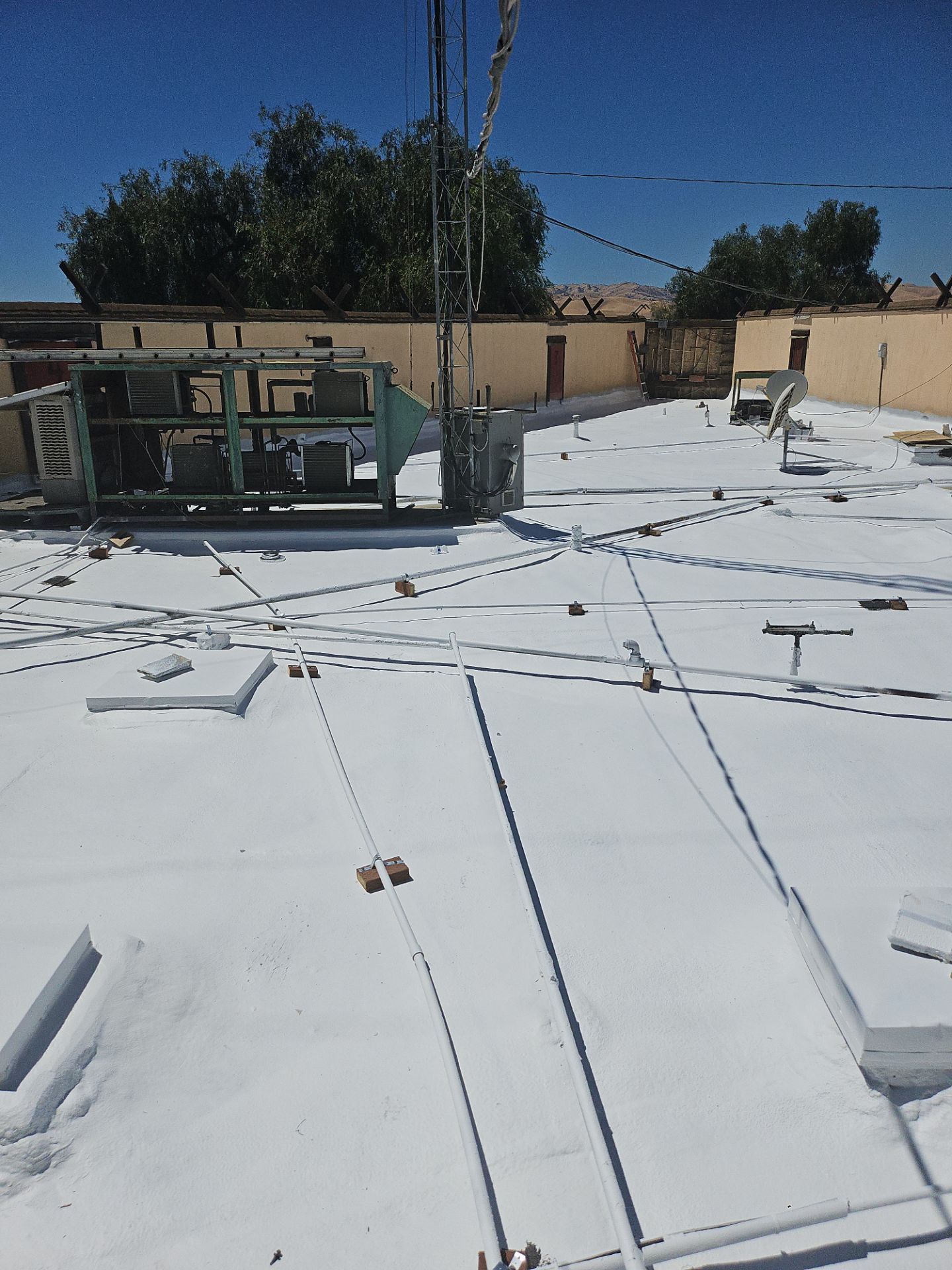 Spray foam and coatings using General Coatings acrylic coatings and spray foam by Straight Edge Roofing Inc