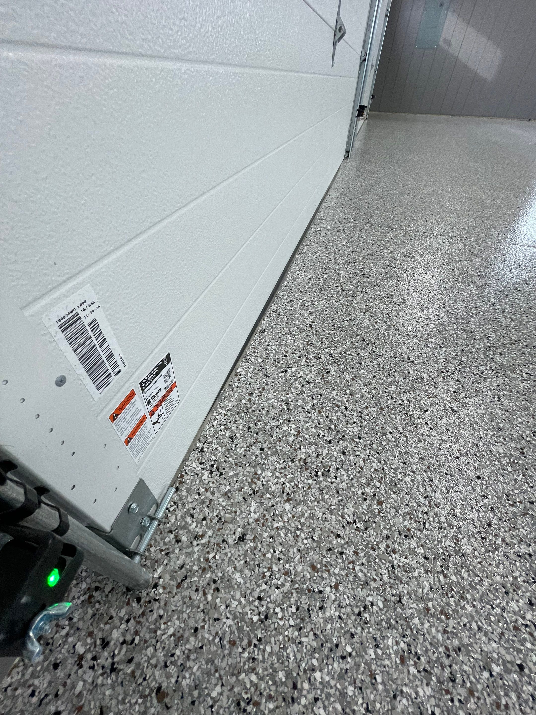 Speckled Epoxy Floor Coating for Large Shop in Rock Valley by Select Painting, Coatings & Garage Cabinets