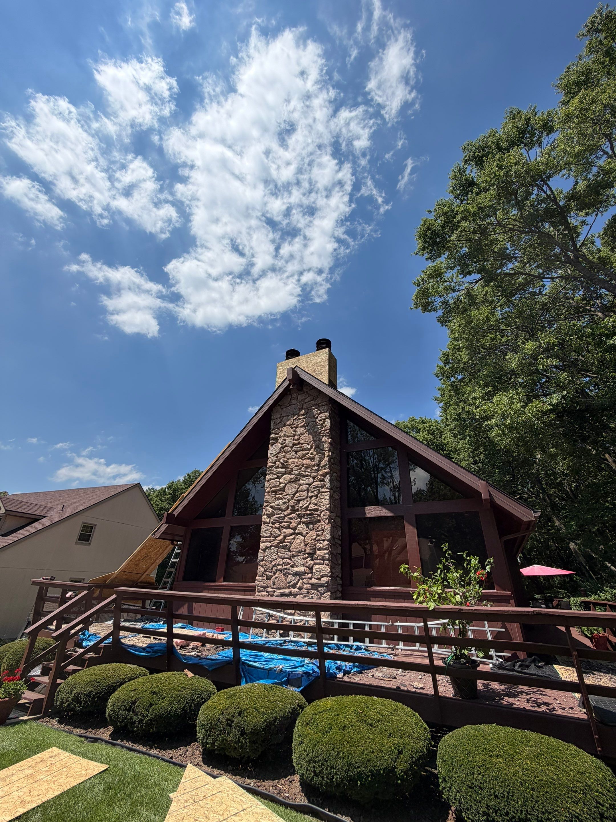Structural Stone Chimney Restoration and Roof Repair in Leavenworth by Summit Roofing