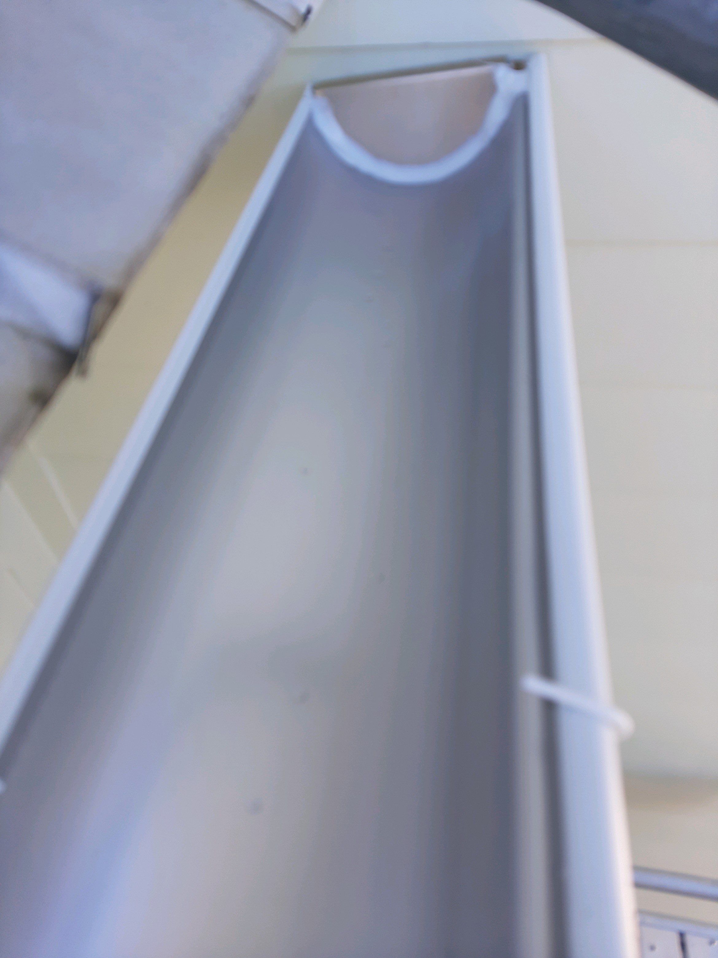 Gutter Installation Using White 6 Inch Seamless Gutters by Gutter Professors