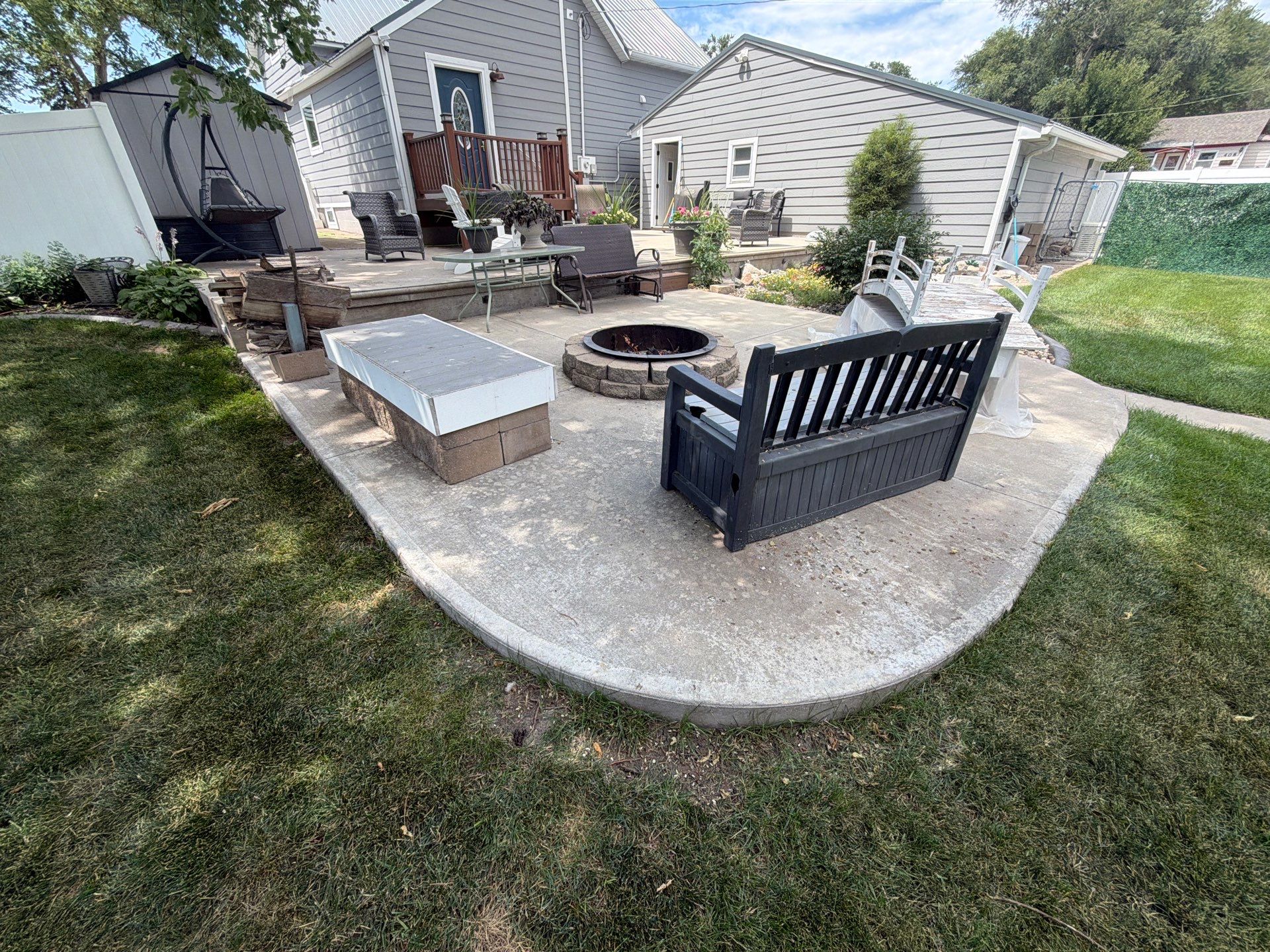 Custom Garage Floor Coating and Backyard Patio Refinishing in Tyndall by Select Painting, Coatings & Garage Cabinets