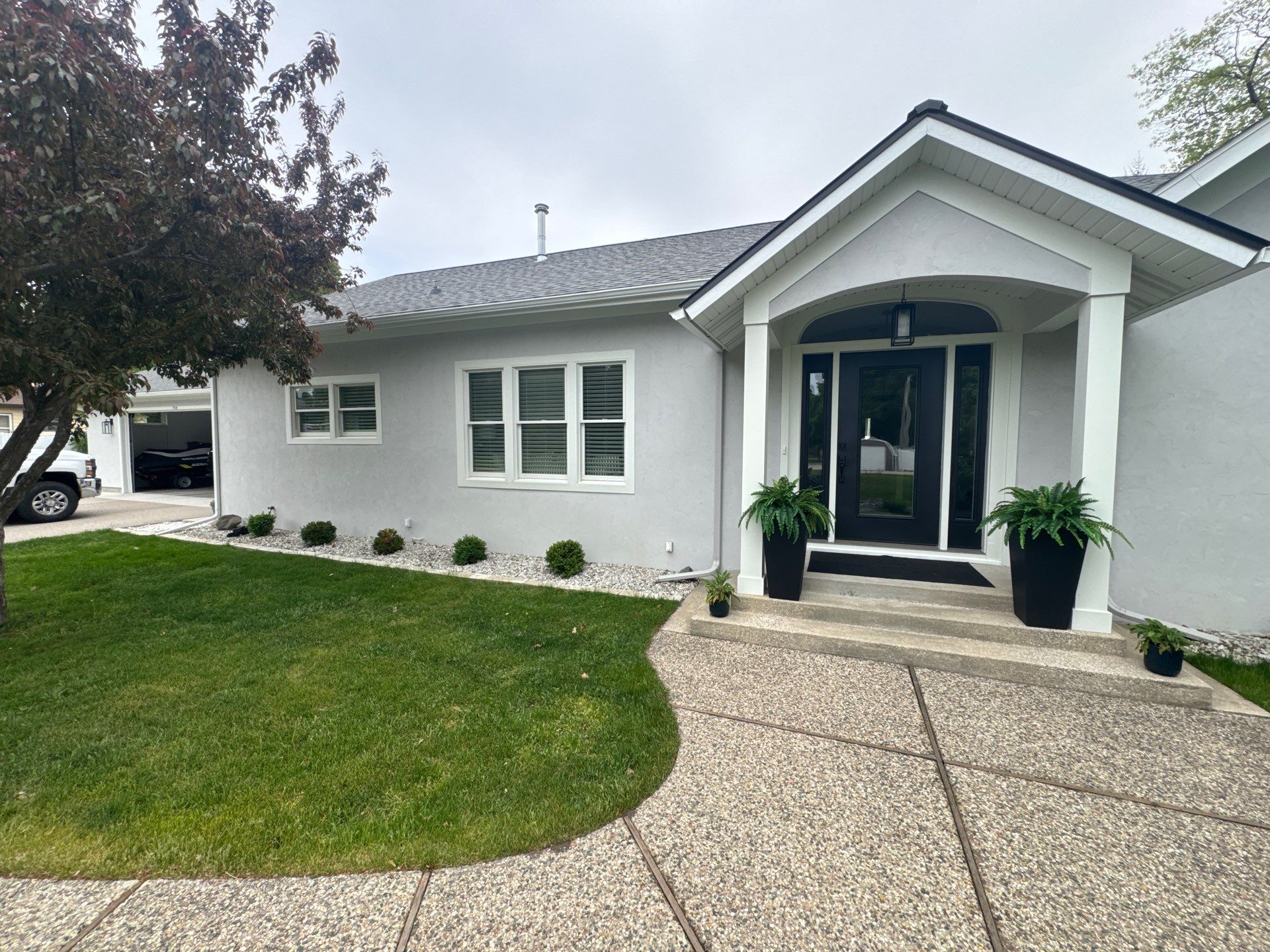 Norton Shores Residential Stucco Repair and Exterior Painting Refresh by Gordon Painting