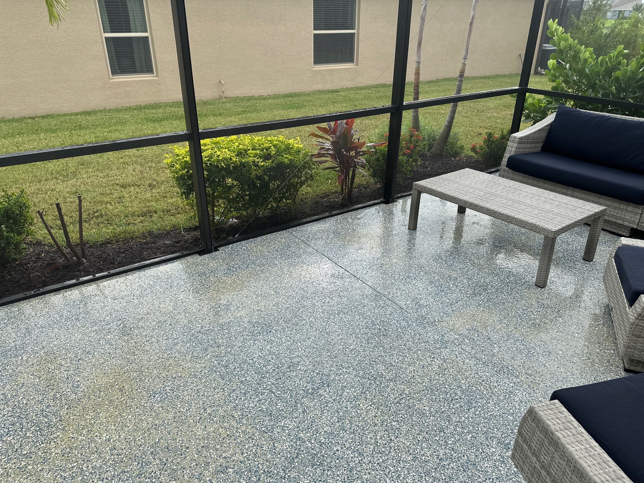 Lanai & Patio Cleaning with Epoxy-Coated Concrete Floor in Trevesta Community, Palmetto, FL | Sunshine AquaWash by Sunshine AquaWash