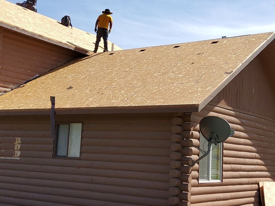 Hill Country Guest Ranch using Steel Roofing, Gutters, Log Cabin Staining by Lightning Exteriors