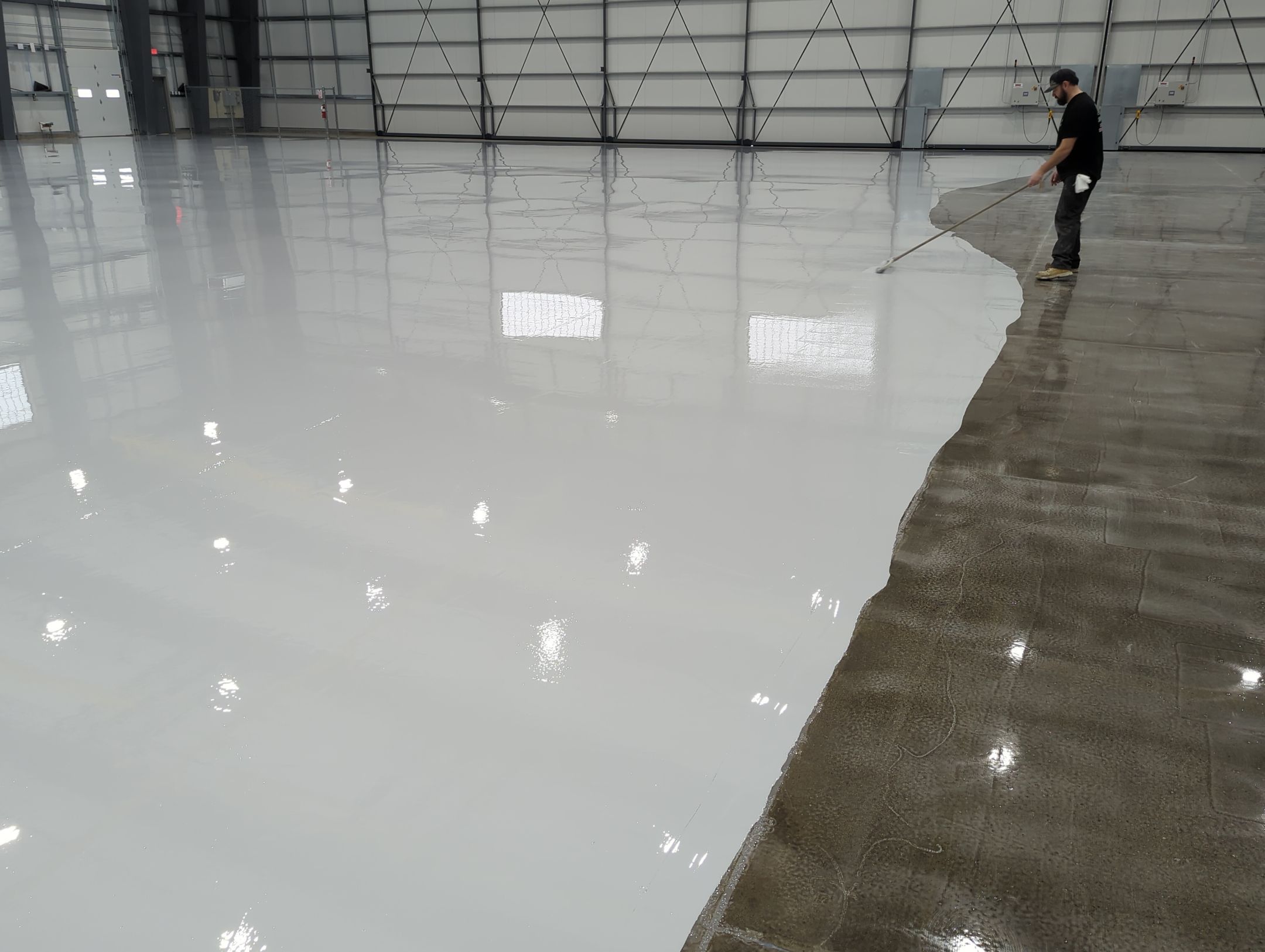 Airplane Hanger using Light Grey Commercial Penntek Epoxy by Croc Coatings, LLC