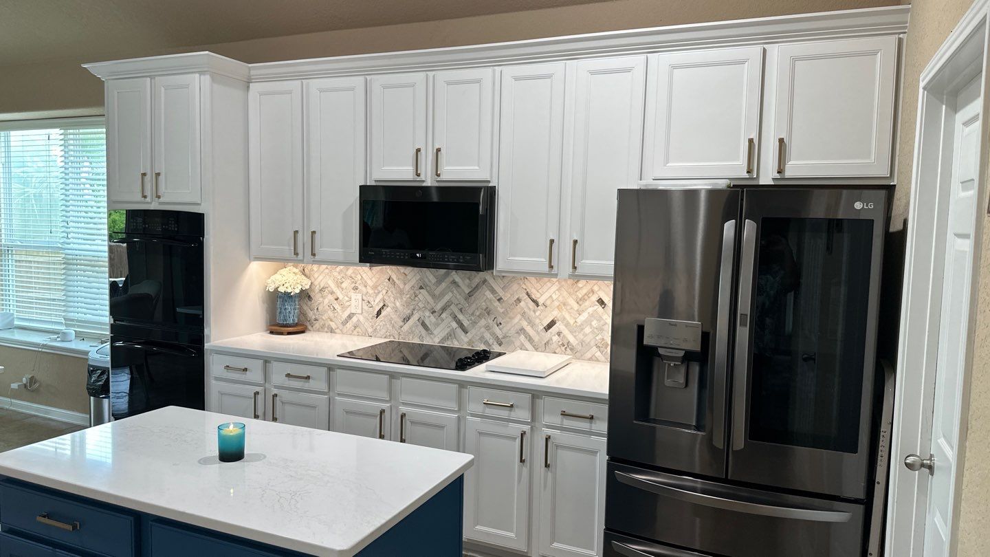 Cibolo Kitchen Refresh with Painted Cabinets, Quartz Countertops & Herringbone Backsplash by Legacy Bath and Kitchen