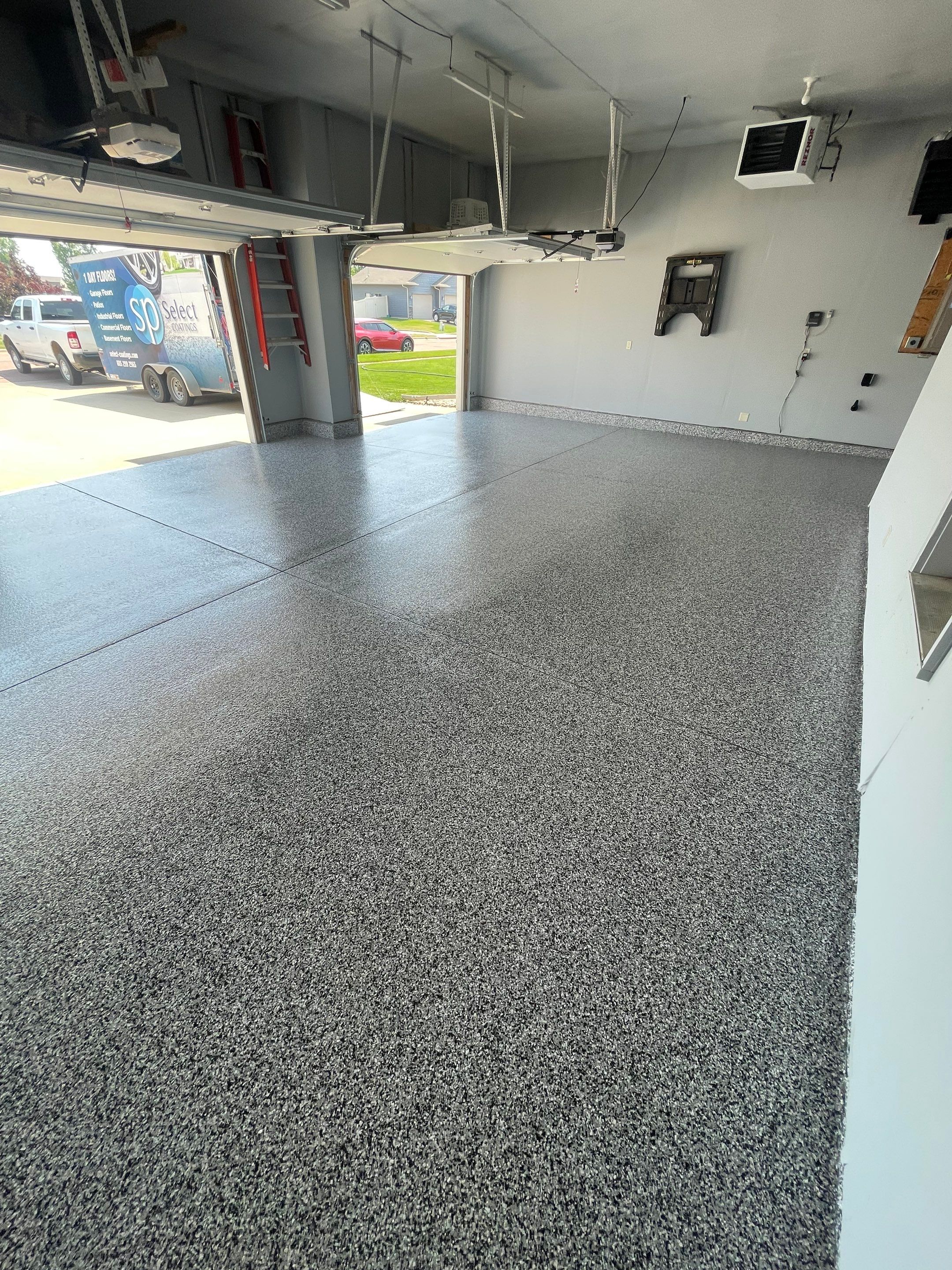 Sioux Falls Garage Concrete Coating Installation with Domino Flake by Select Painting, Coatings & Garage Cabinets