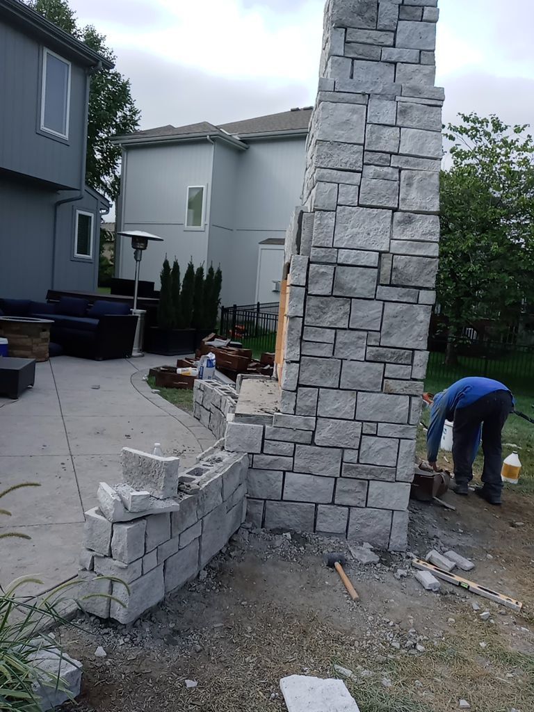 Back Yard Fireplace and Landscape by LAND ESCAPES LLC