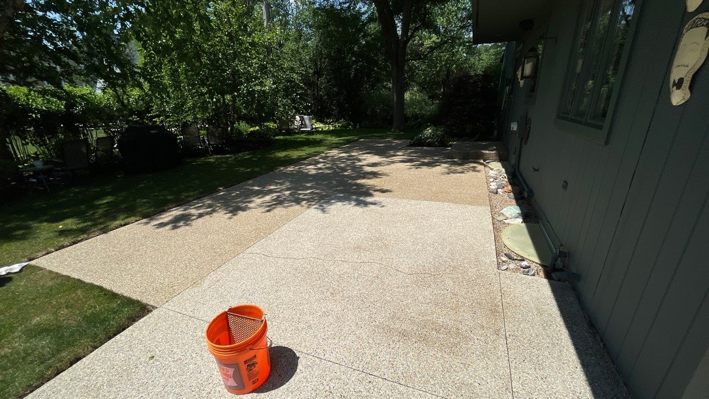 Aggregate concrete cleaning and sealing using Surebond SB-9000 by Northern Power Washing LLC.