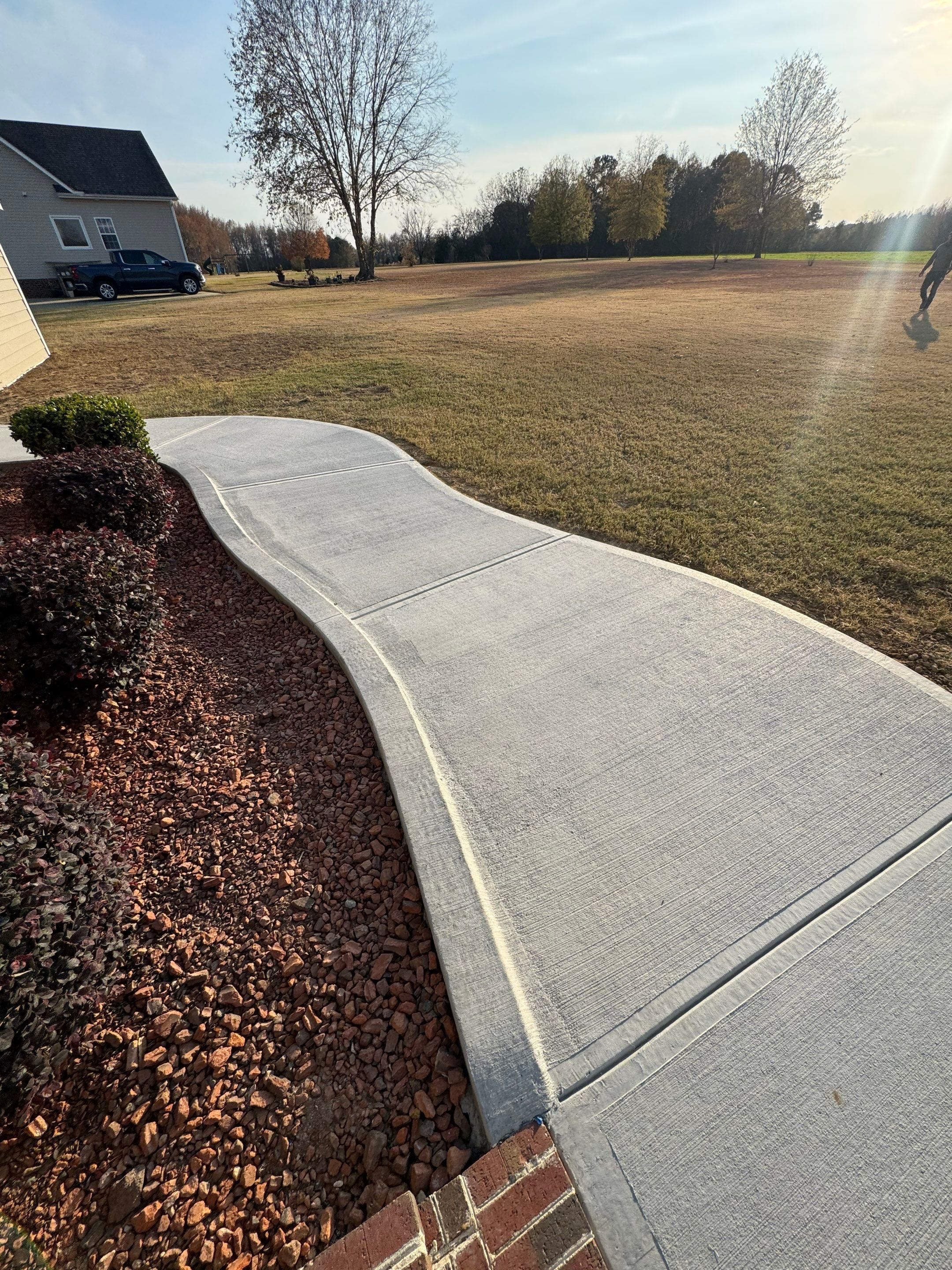 Custom Screened Porch and Concrete Walkway Installation in Rocky Mount by The Remodeling Company