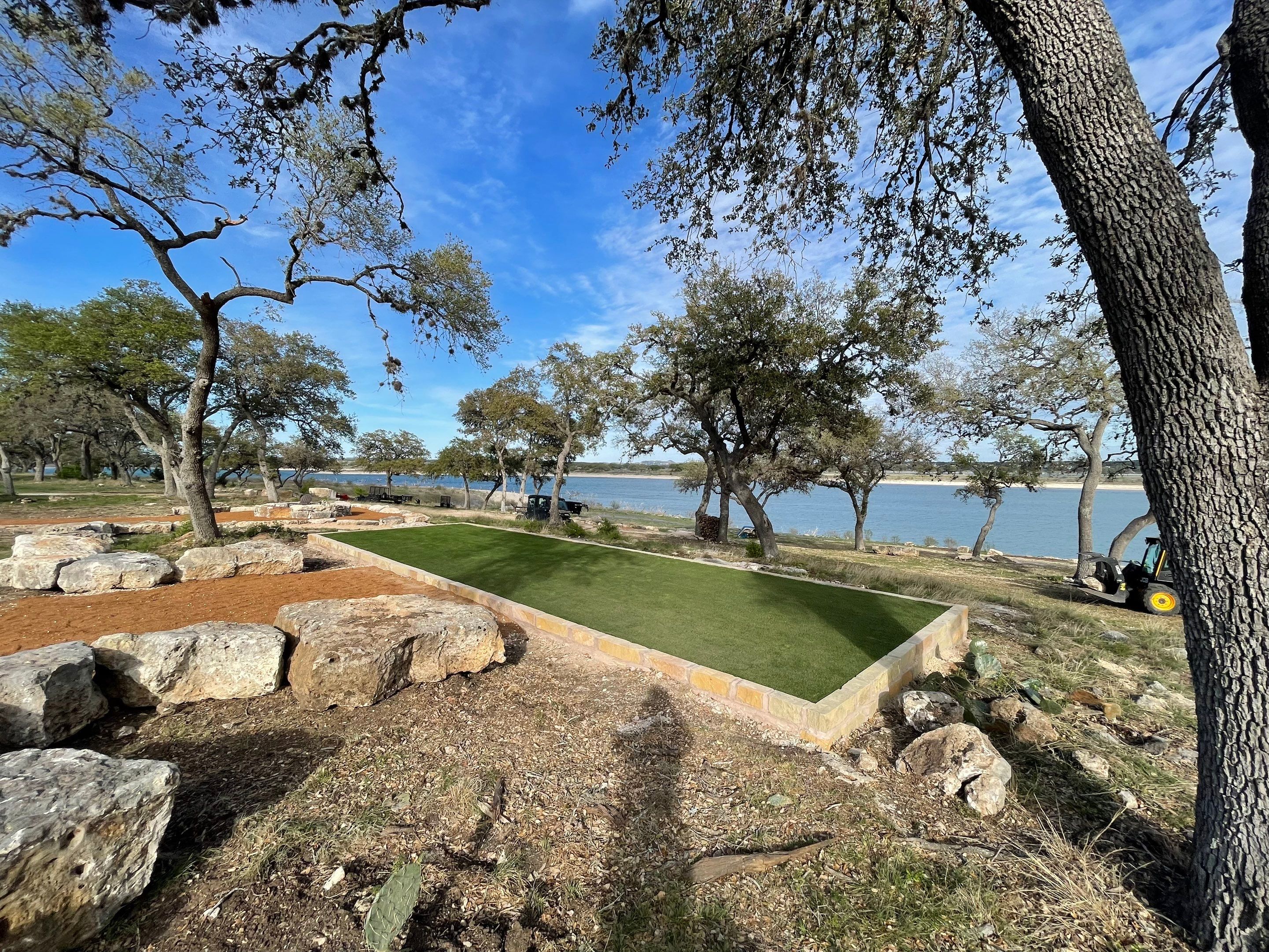 Lakeside Firepit and Turf Area by Singer Services