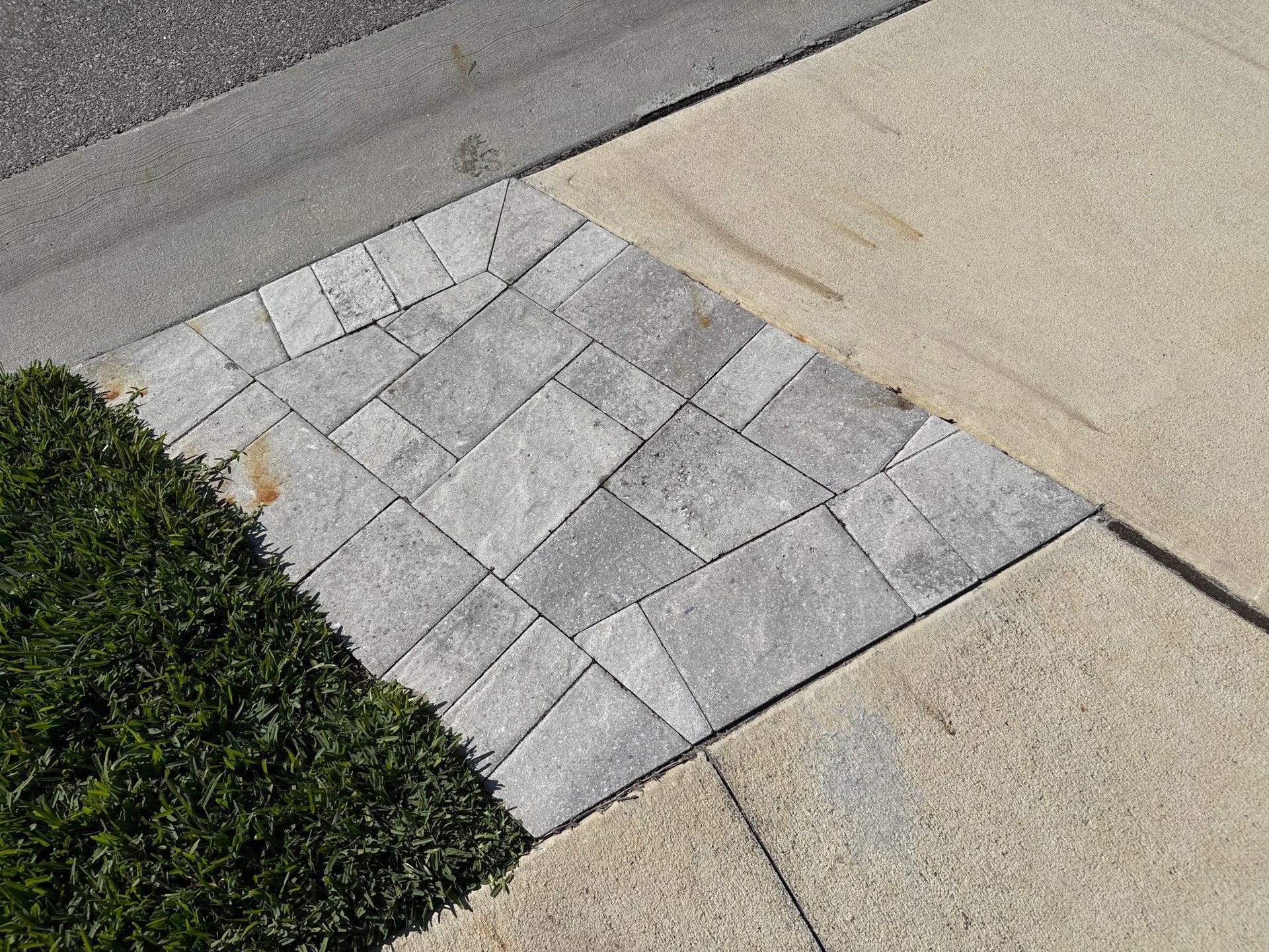 Rust Stain Removal from Concrete Driveway and Pavers in Park East at Azario | Lakewood Ranch, FL by Sunshine AquaWash