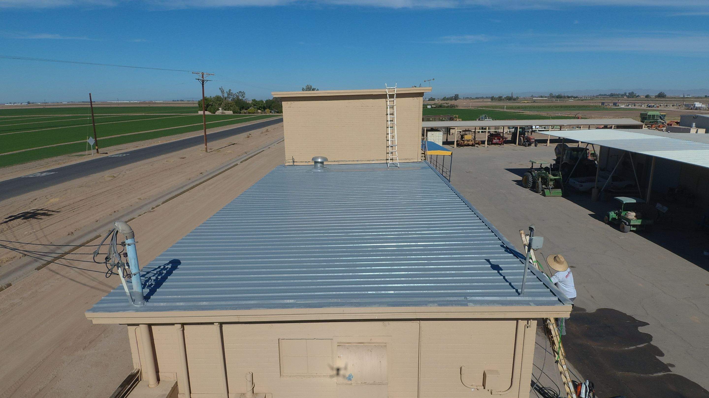 Metal roof restoration on commercial roof using Conklin Benchmark/PUMA XL fabric and coating by Straight Edge Roofing Inc