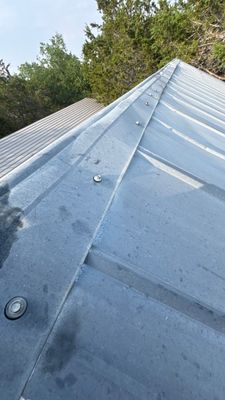 View along the ridge of a metal roof.