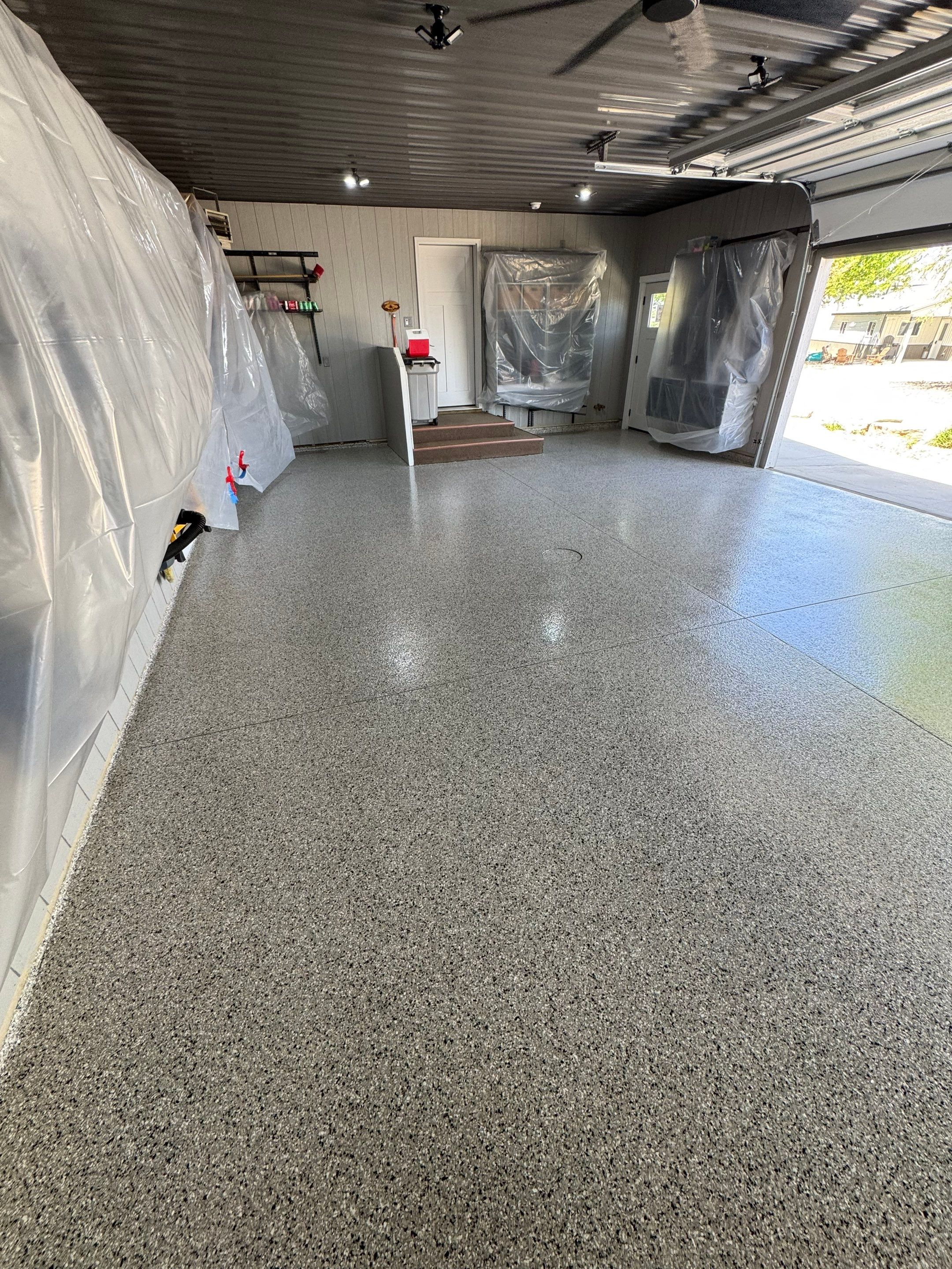 High-Gloss Grey Epoxy Floor Coating for Inwood Garage by Select Painting, Coatings & Garage Cabinets