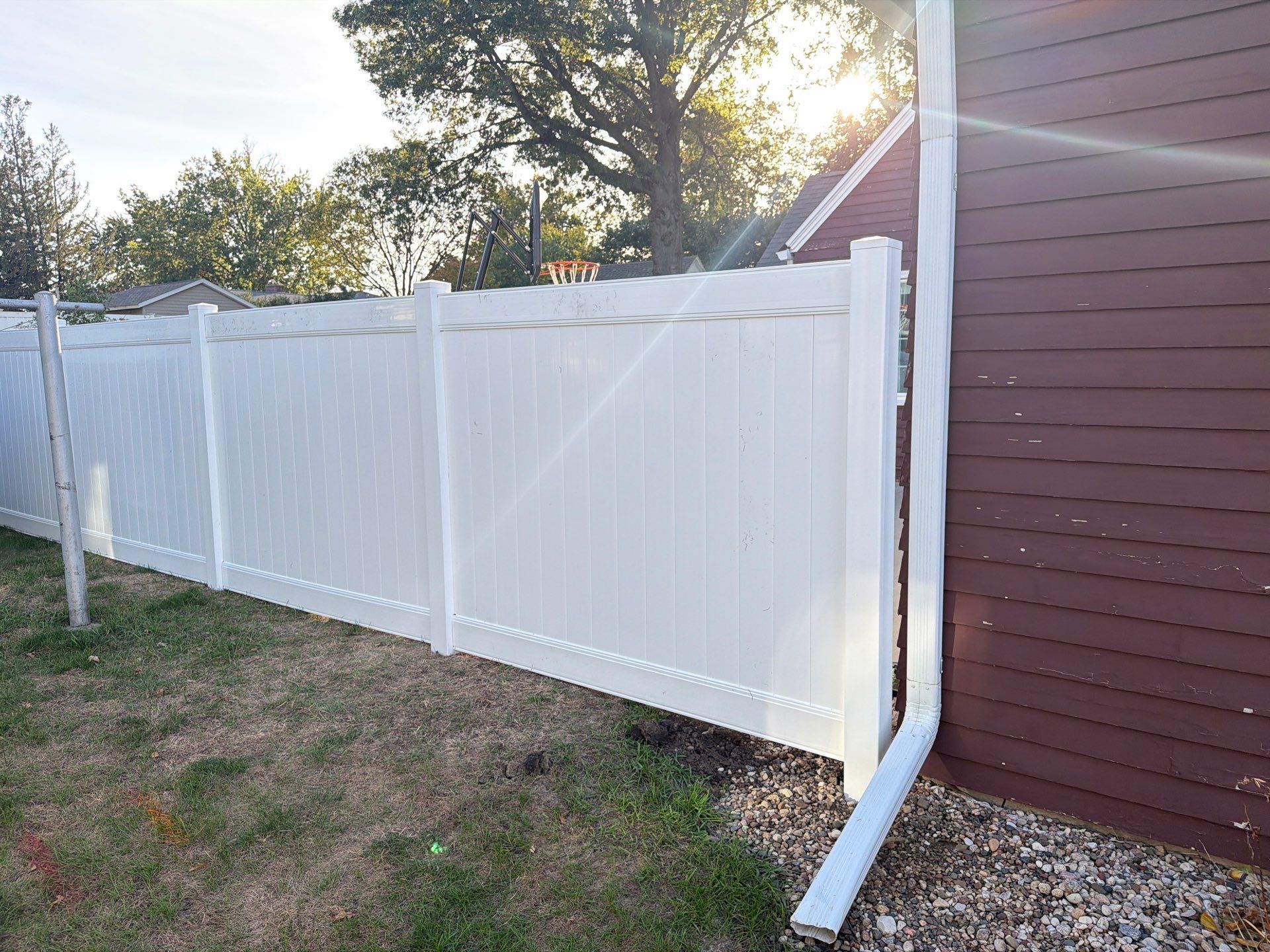 White Vinyl Privacy Fence and Gate Installation in Grundy Center by Perfect Picket Fence and Stain