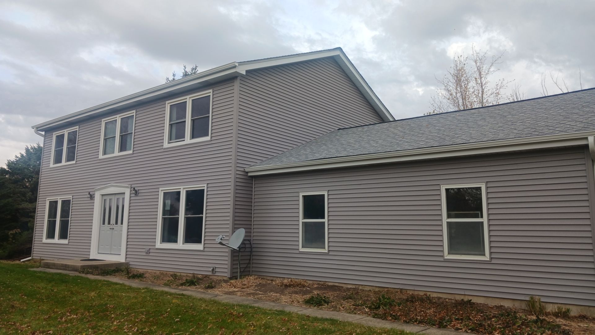 New Siding and Windows by NextWave Construction