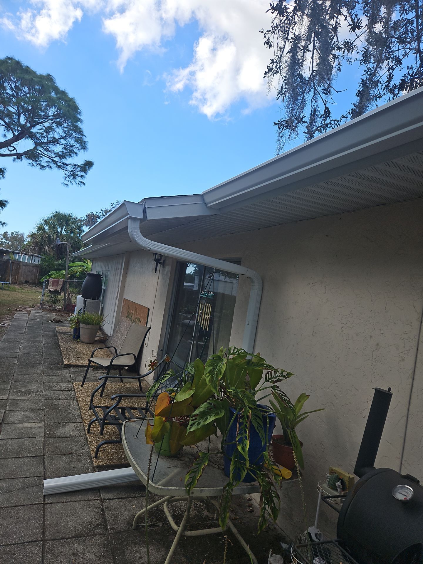 Downspout Installation using White Down Spouts in Sarasota FL by Gutter Professors