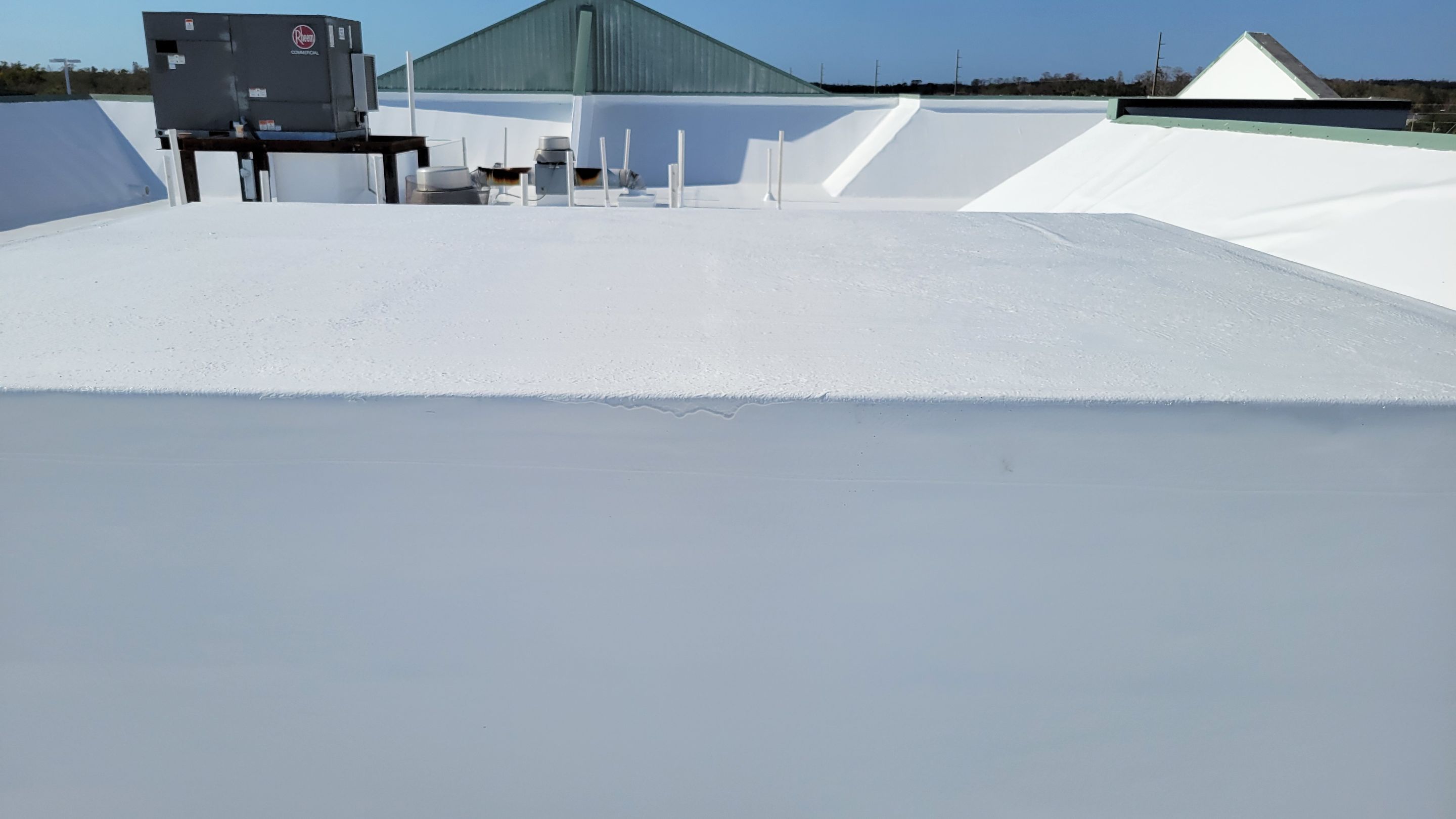 Commercial White Silicone Roof Coating for Hotel in Oldsmar by CES Roofing