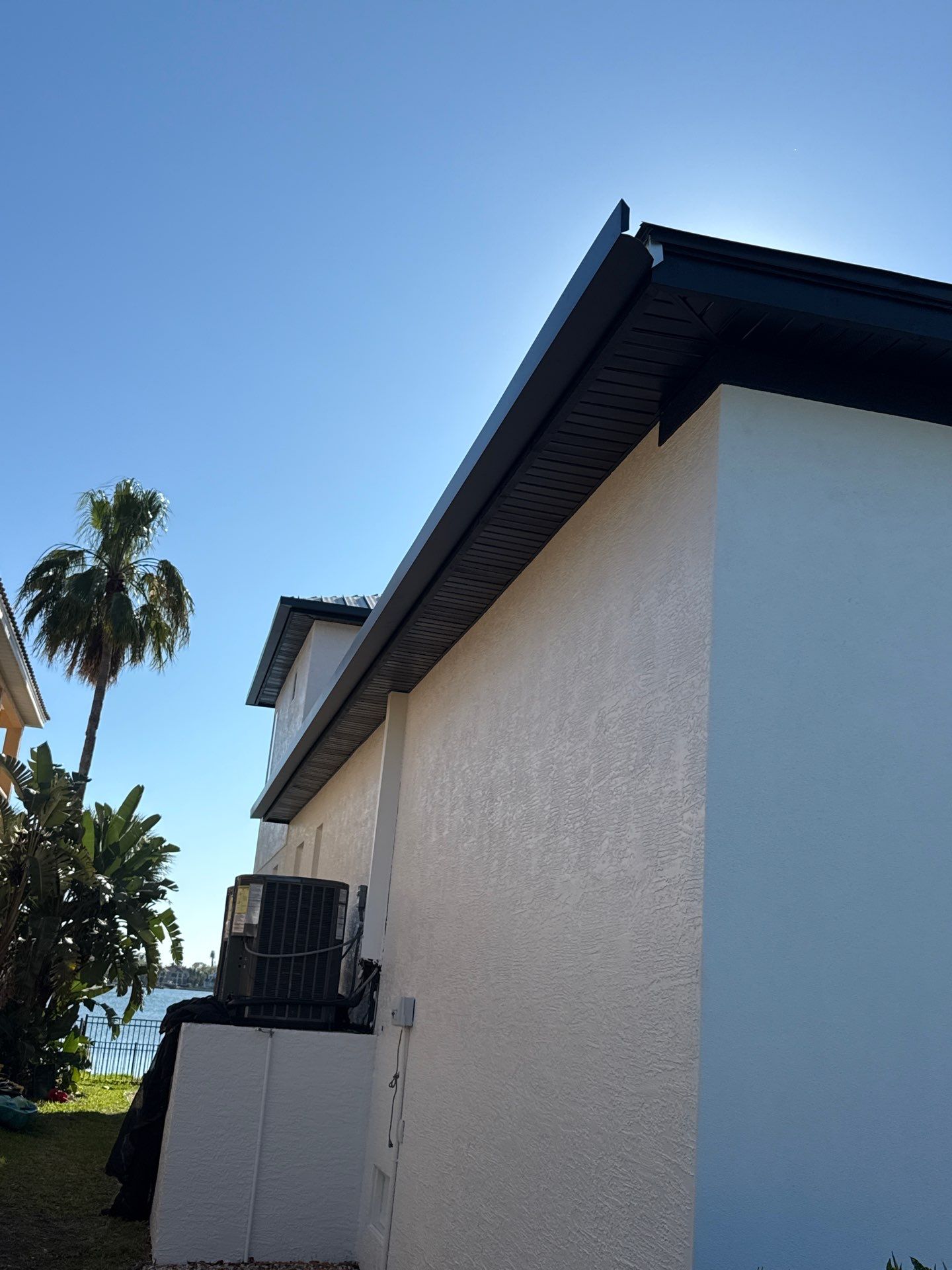 Soffit and Fascia Installation and black seamless gutters in Sarasota FL by Gutter Professors